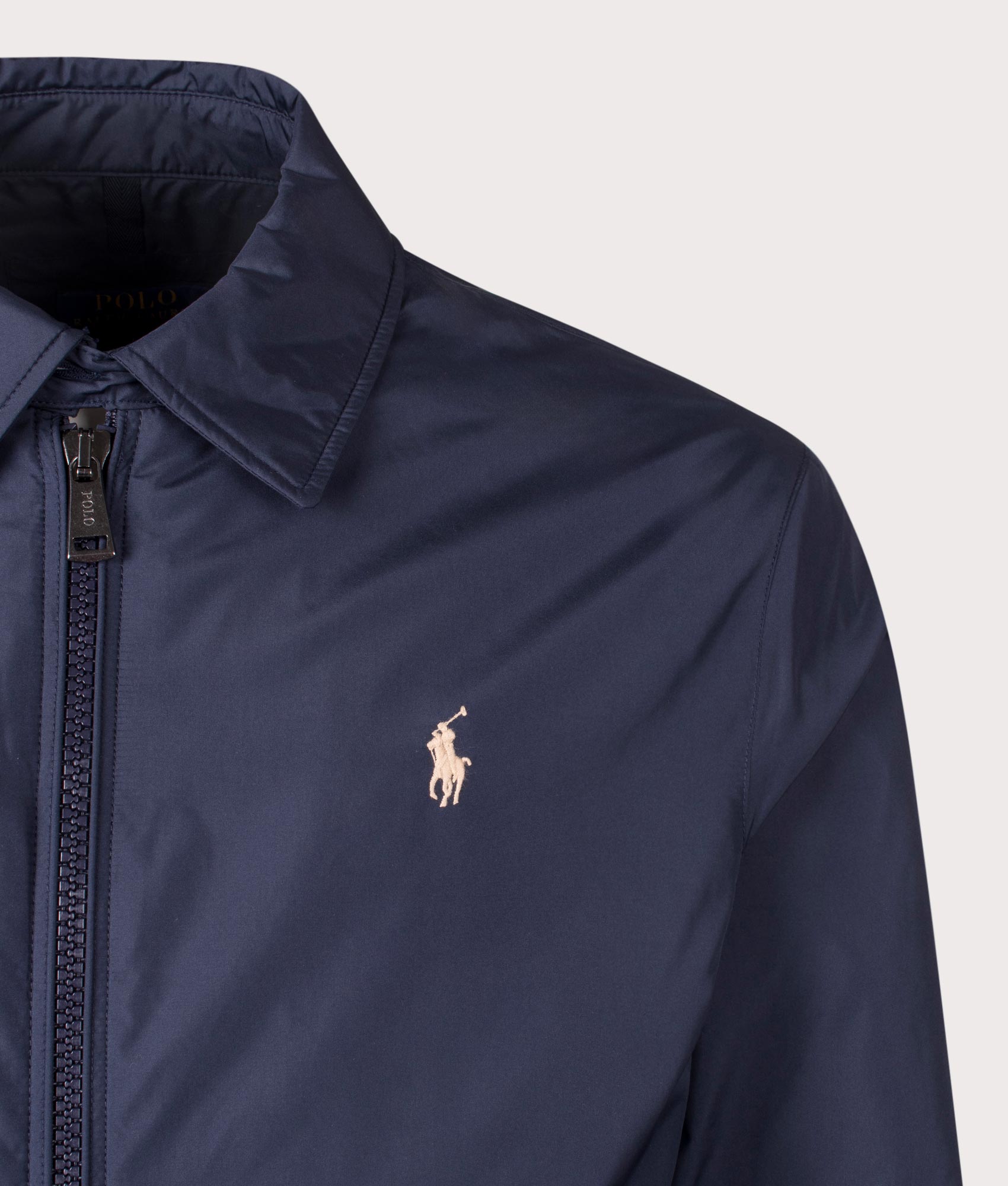 Polo Ralph Lauren Packable Windbreaker Jacket in Navy. Detail Shot at EQVVS.
