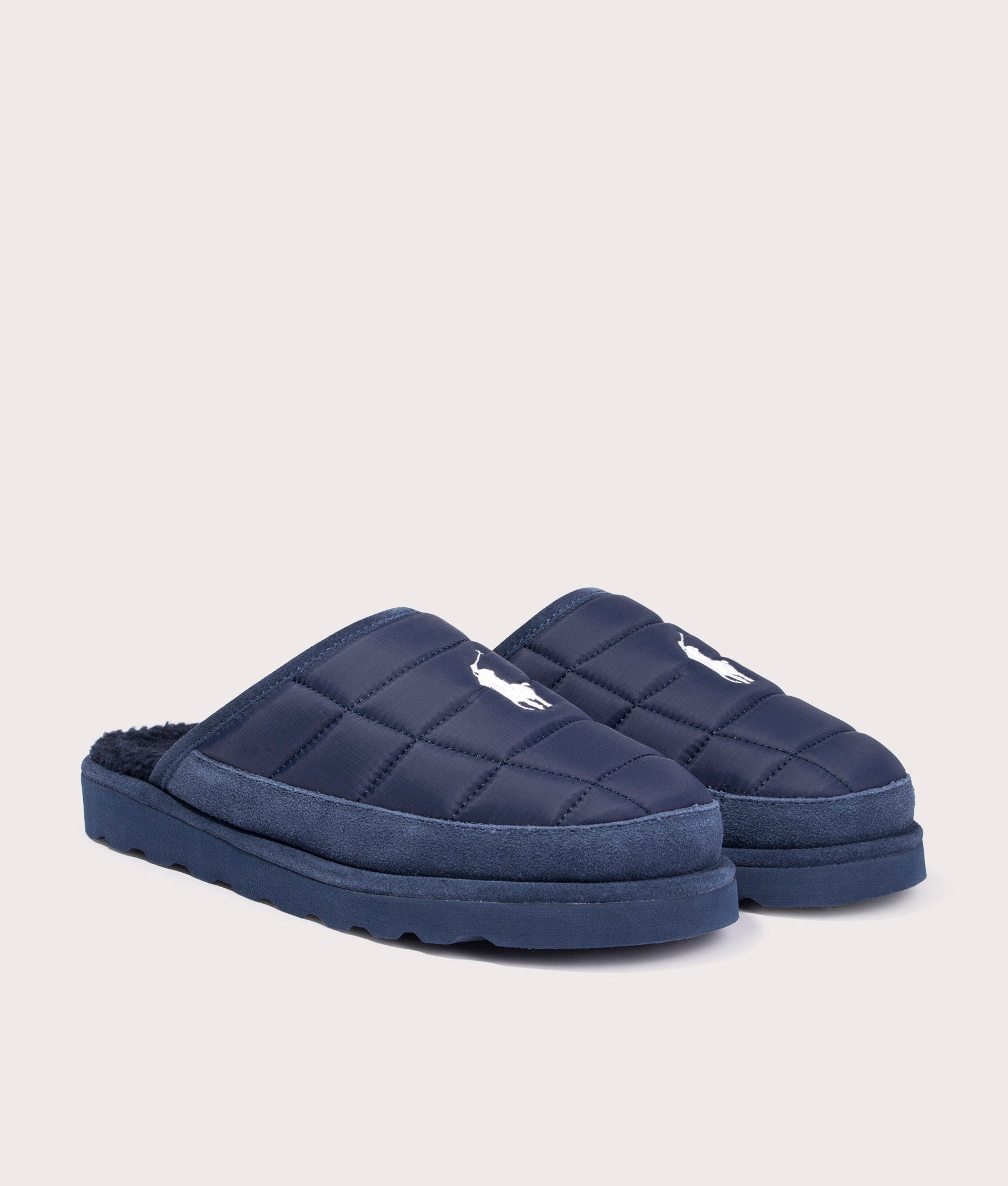 Reade Slip on Slippers in Navy by Polo Ralph Lauren. Shot at EQVVS. Front angle. 