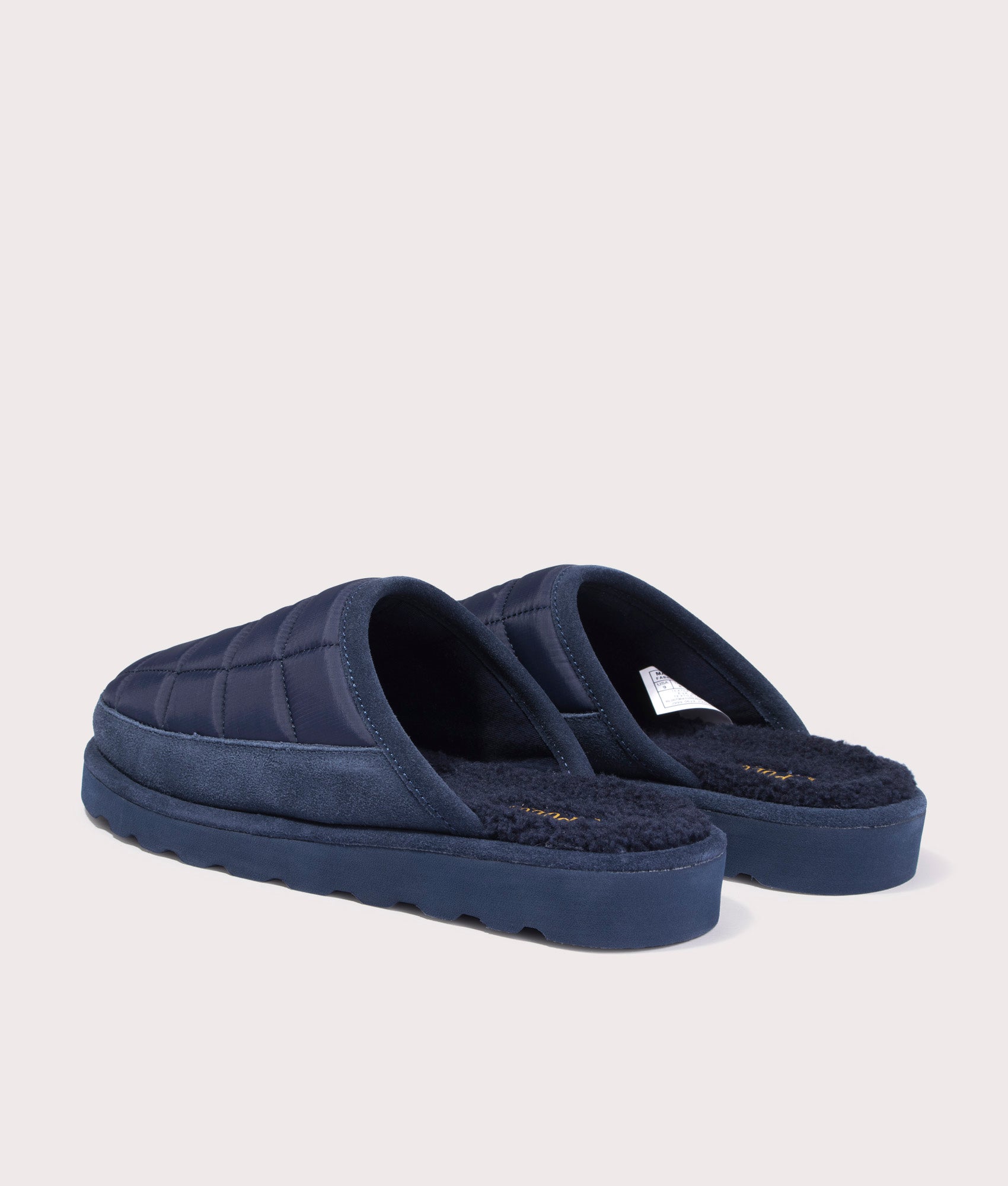 Reade Slip on Slippers in Navy by Polo Ralph Lauren. Shot at EQVVS. Back angle. 