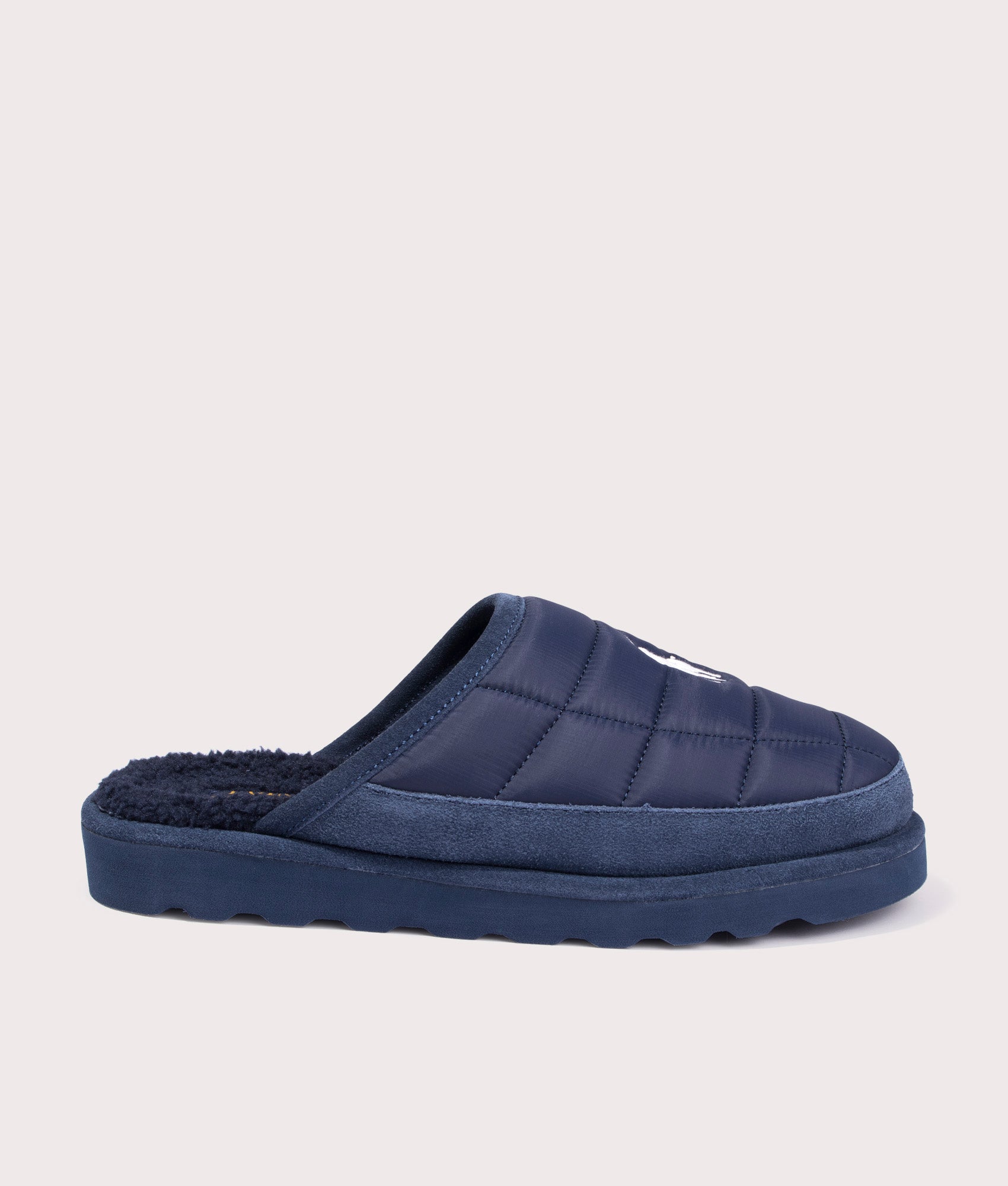 Reade Slip on Dress Slippers in Navy by Polo Ralph Lauren. Shot at EQVVS. Side profile. 