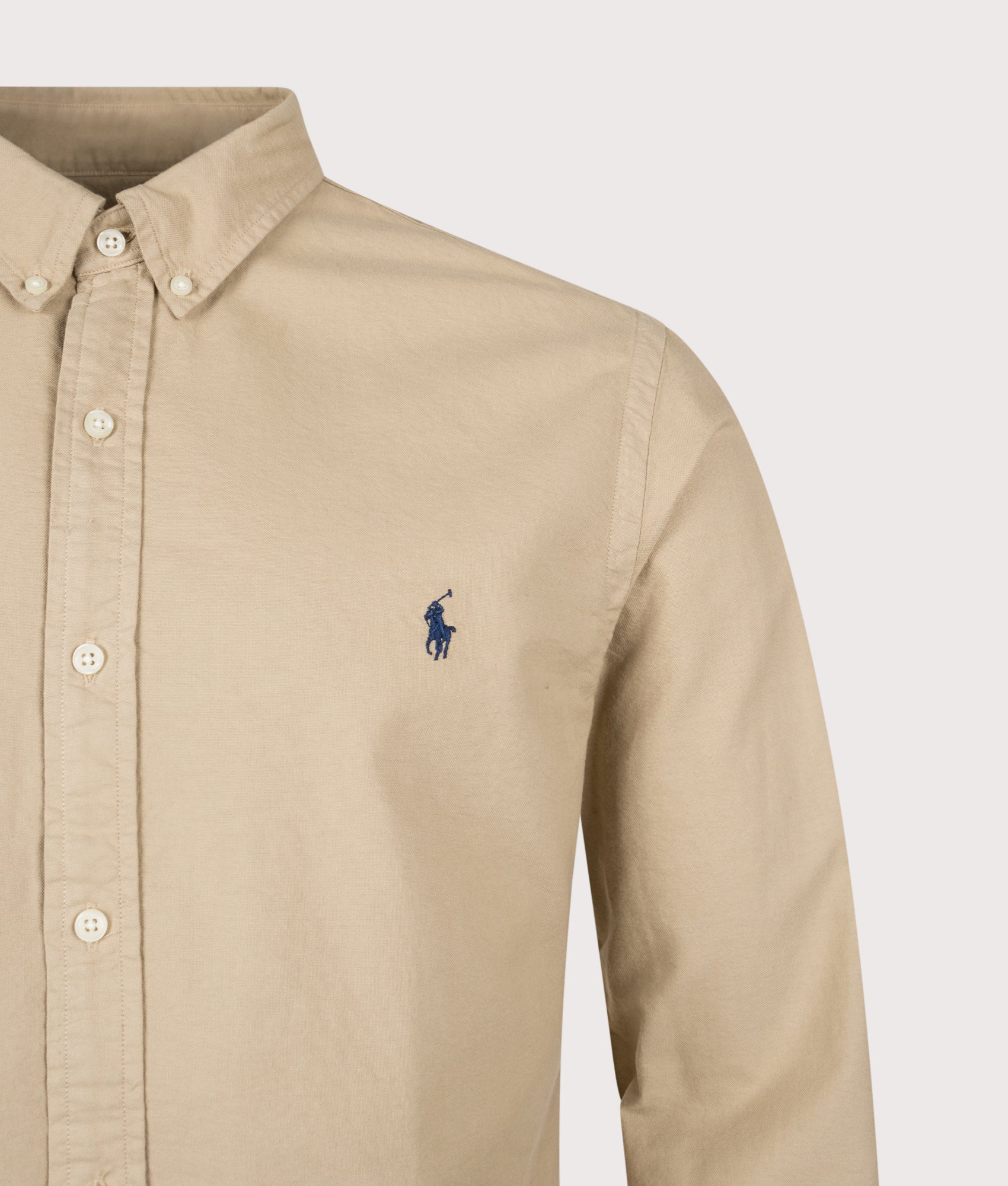 Polo Ralph Lauren Slim Fit Long Sleeve Garment-Dyed Oxford Shirt in Surrey Tan at EQVVS Menswear. Detail shot.
