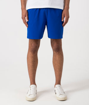 Regular Fit Traveler Mid Swim Shorts in Rugby Royal. Front angle shot at EQVVS.