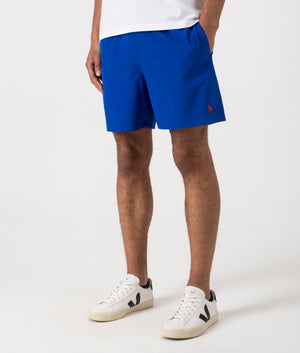 Regular Fit Traveler Mid Swim Shorts in Rugby Royal. Side angle shot at EQVVS.