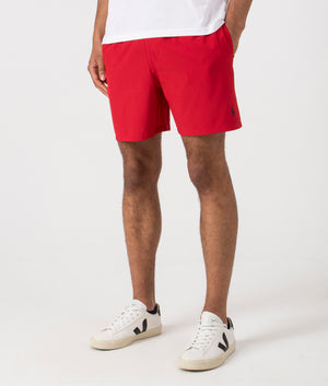 Regular Fit Traveler Mid Swim Shorts in Red. Side angle shot at EQVVS.