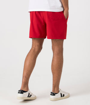 Regular Fit Traveler Mid Swim Shorts in Red. Back angle shot at EQVVS.