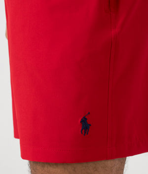 Regular Fit Traveler Mid Swim Shorts in Red. Detail shot at EQVVS.