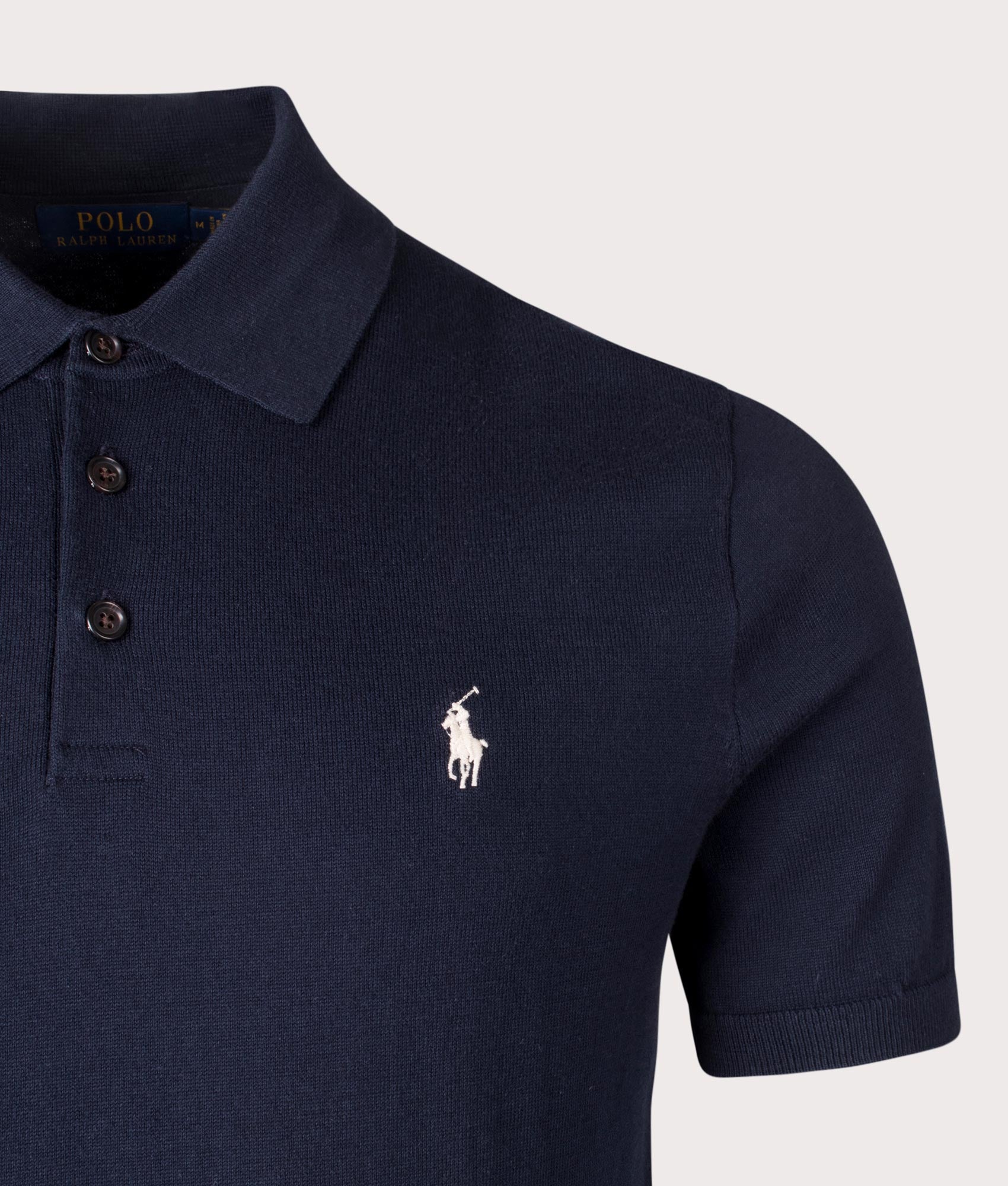 Polo Ralph Lauren Cotton Knitted Polo Shirt in Hunter Navy. Shot at EQVVS. Front logo shot