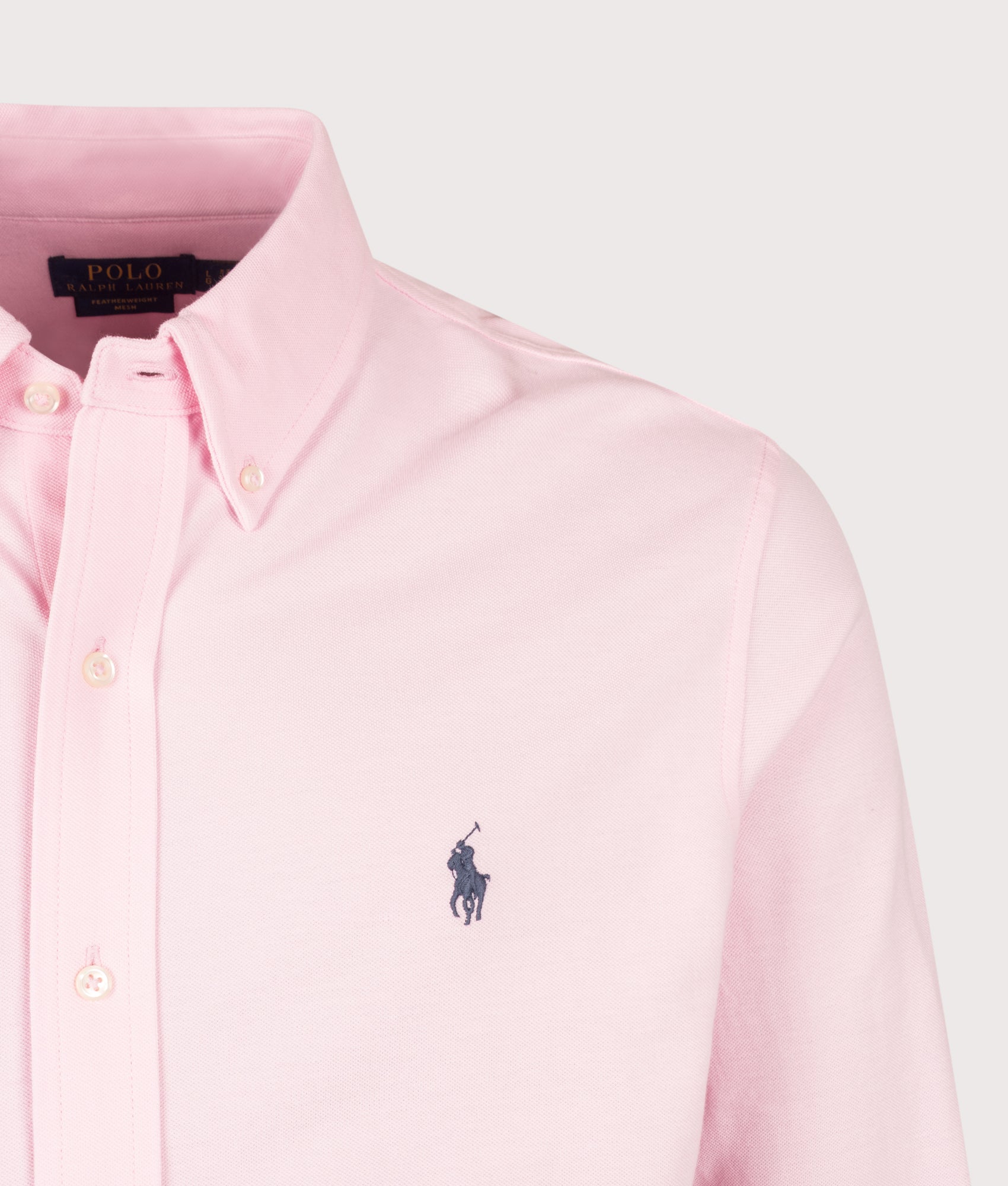 Polo Ralph Lauren Relaxed Fit Featherweight Mesh Shirt in Carmel Pink at EQVVS Menswear. Detail shot.
