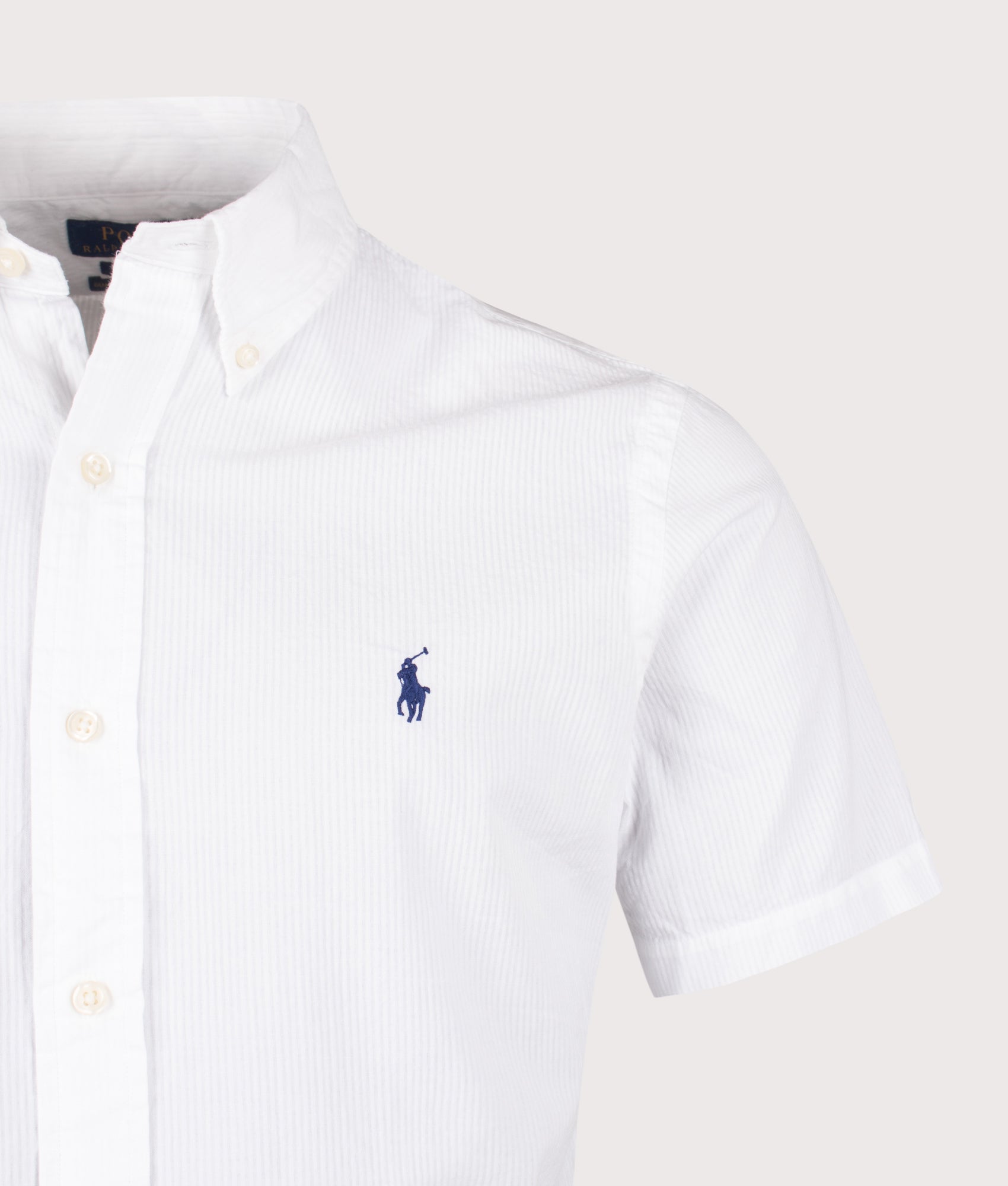 Polo Ralph Lauren Custom Fit Short Sleeve Seersucker Shirt in White at EQVVS Menswear. Detail shot.