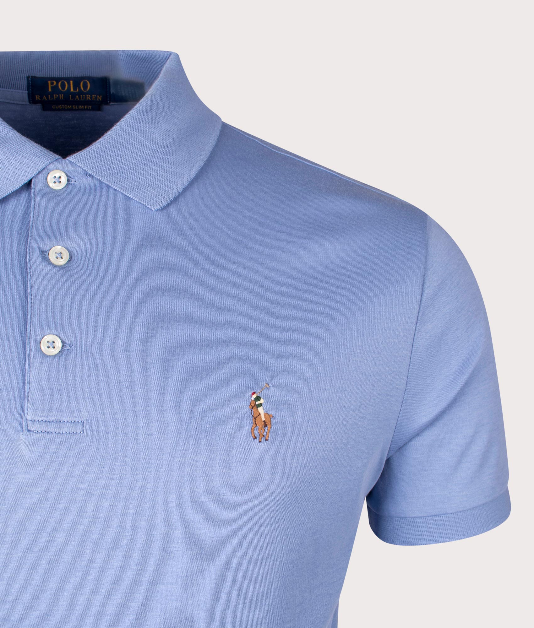 Custom Slim Fit Polo Shirt in Blue by Polo Ralph Lauren . Detail shot at EQVVS. 