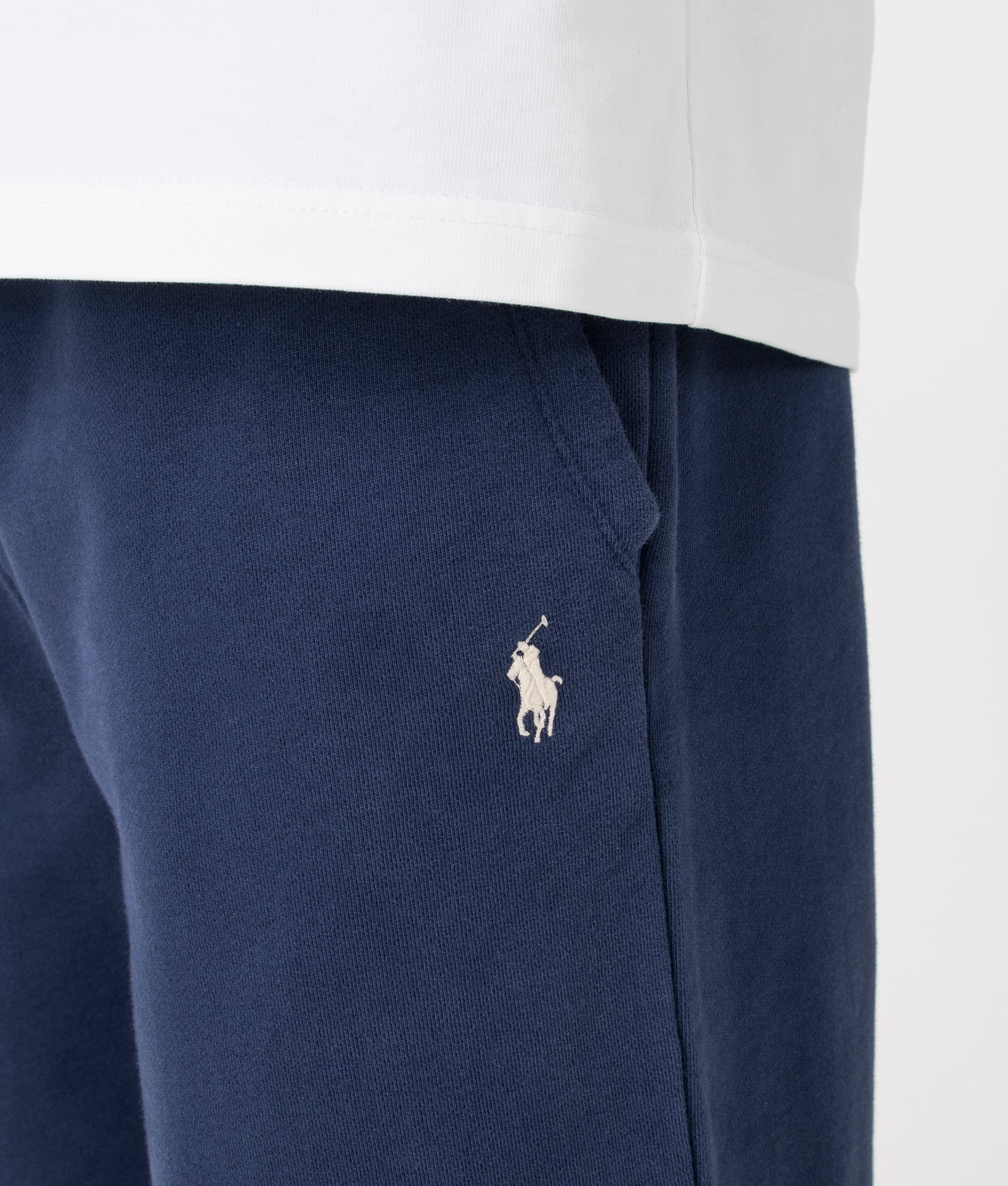 Polo Ralph Lauren Loopback Fleece Drawstring Joggers in Cruise Navy. Detail angle model shot at EQVVS.