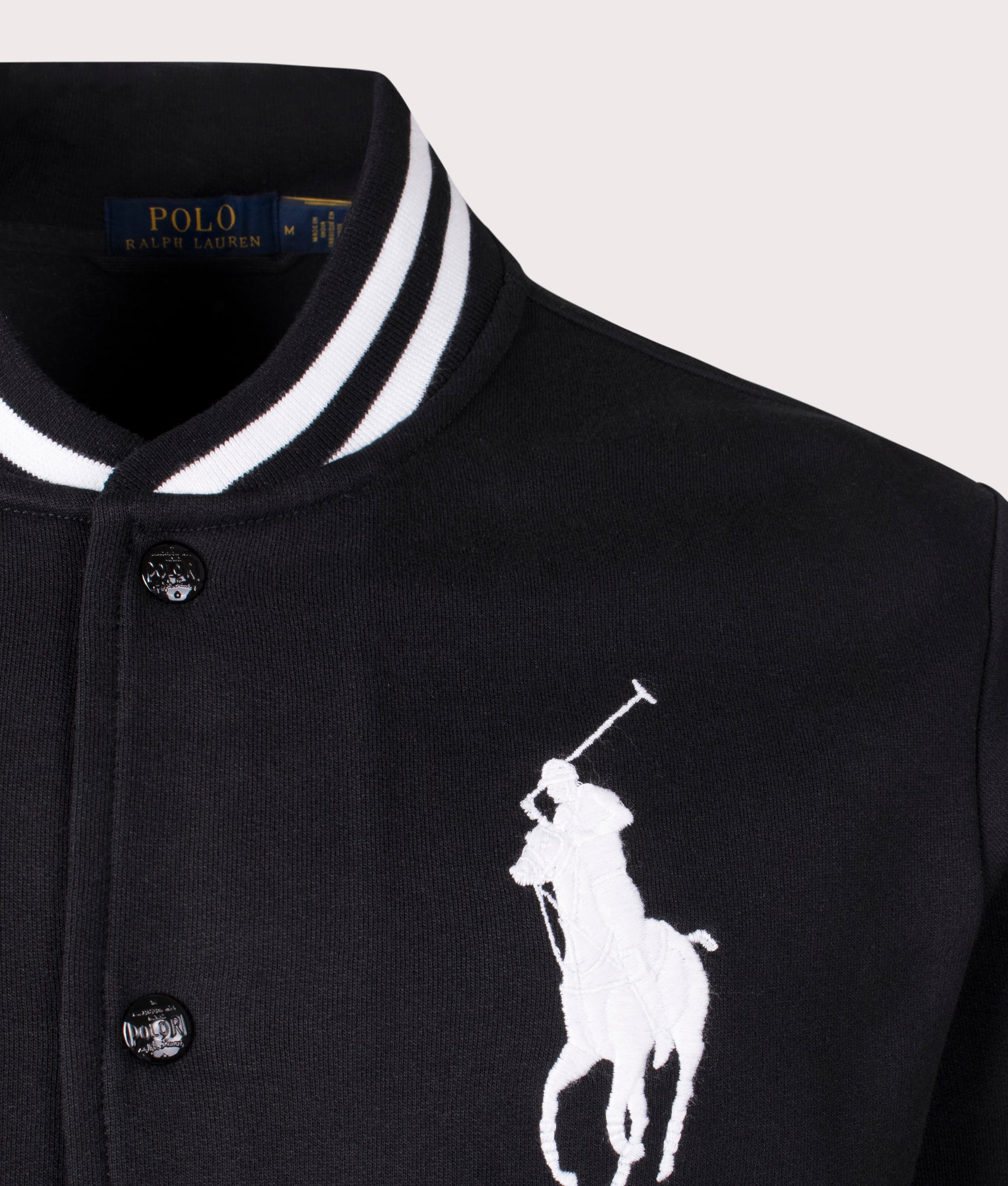 Polo Ralph Lauren Big Pony Fleece Baseball Jacket in Black. Shot at EQVVS. Front logo shot 