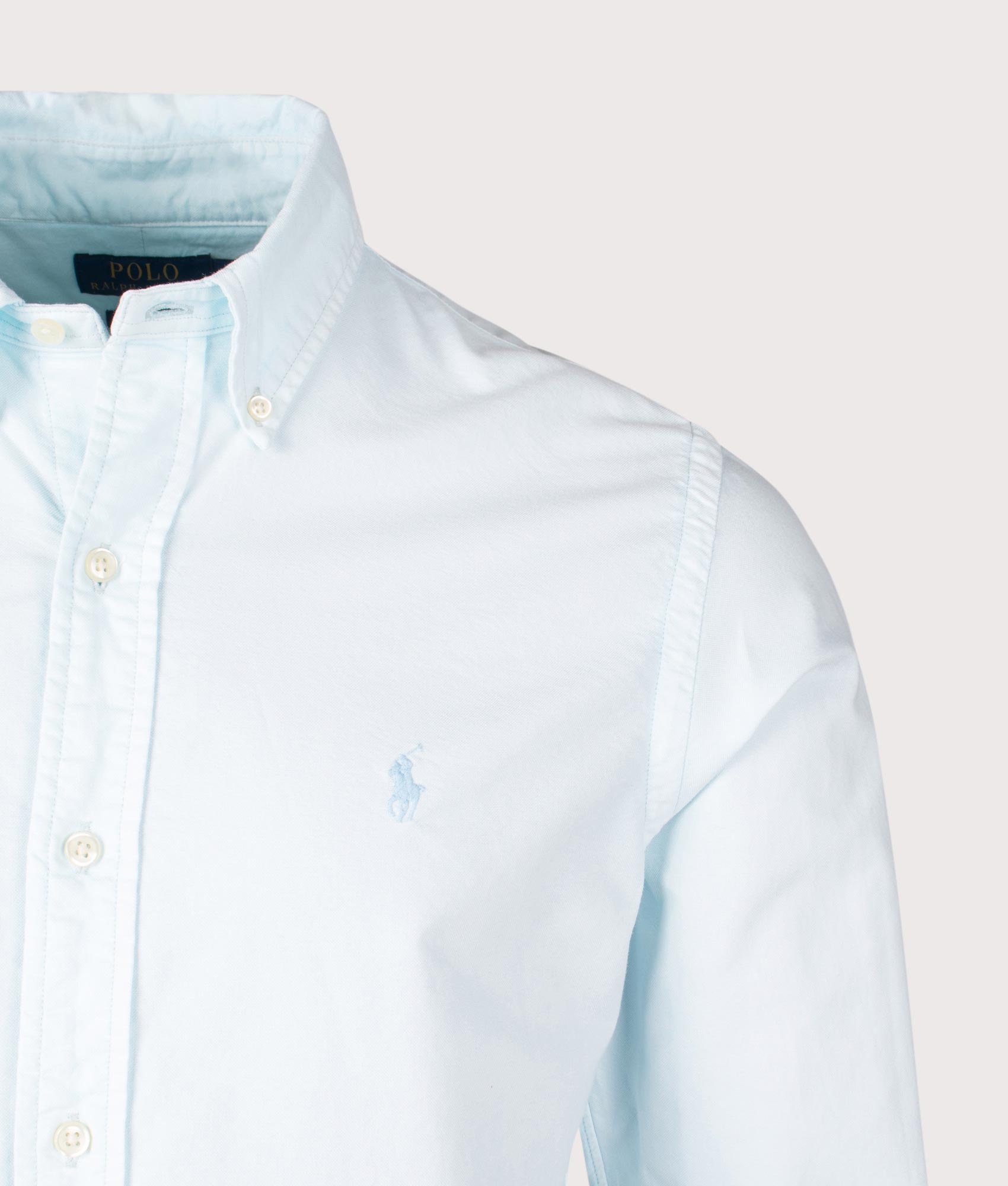 Polo Ralph Lauren Custom Fit Mineral-Dyed Oxford Shirt in Sky. Shot at EQVVS. Front detail shot 