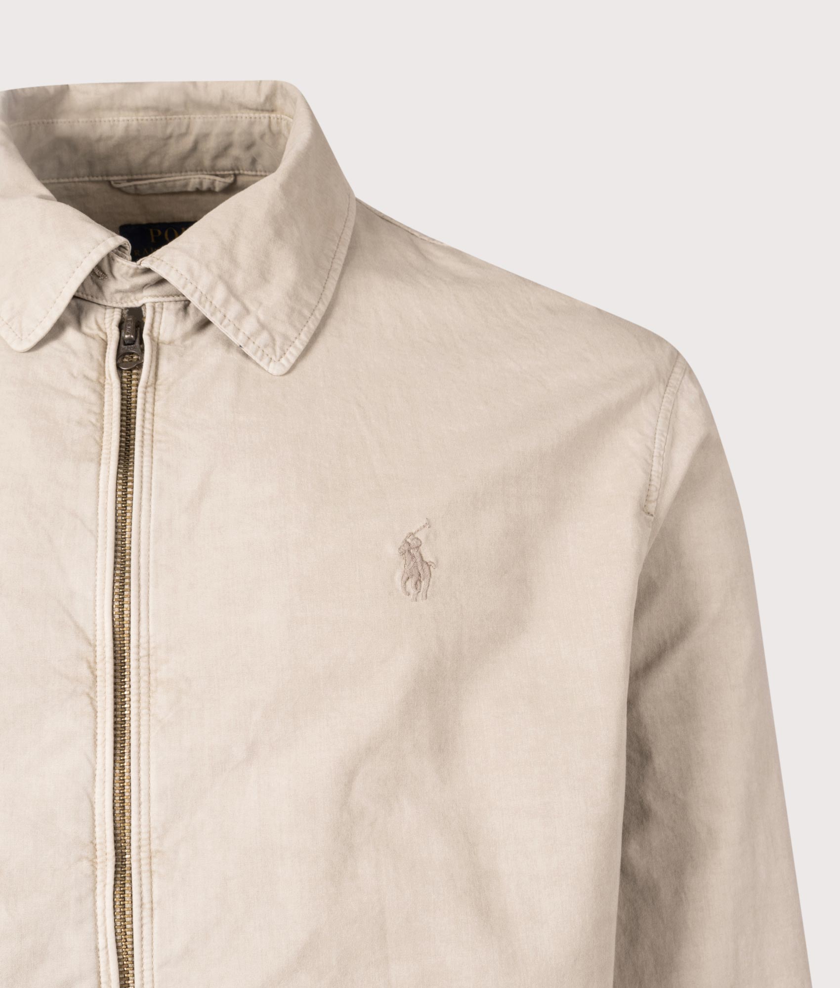 Polo Ralph Lauren The Bayport Mineral-Dyed Poplin Jacket in Olive. Shot at EQVVS. Front detail shot 