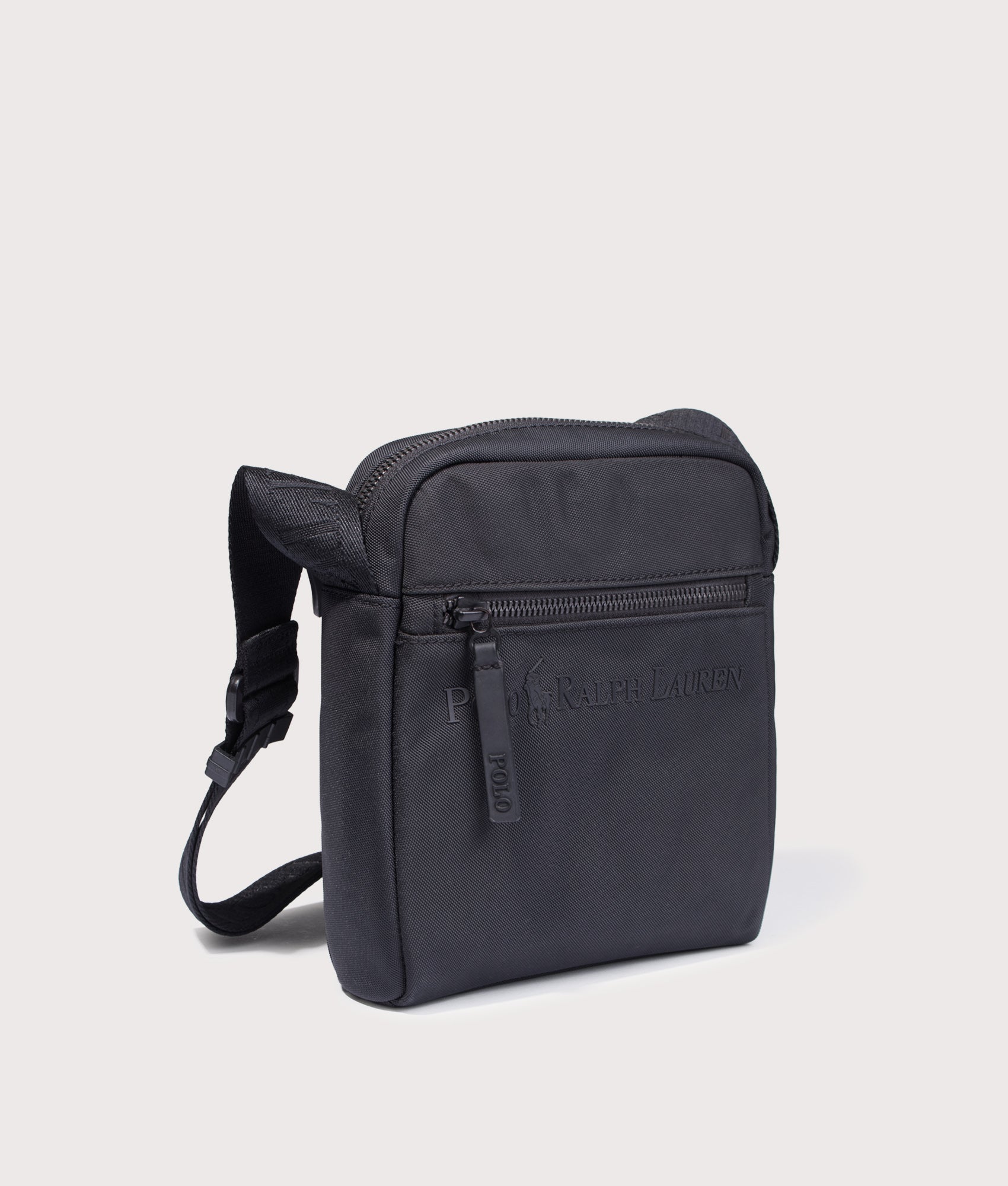 Polo Ralph Lauren Tonal Logo Crossbody bag in Black at EQVVS Menswear. Angled front shot.