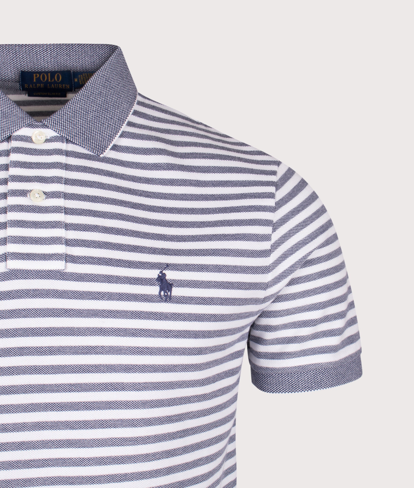 Custom Slim Fit Striped Mesh Polo Shirt in Newport Navy and White at EQVVS Menswear. Detail shot.