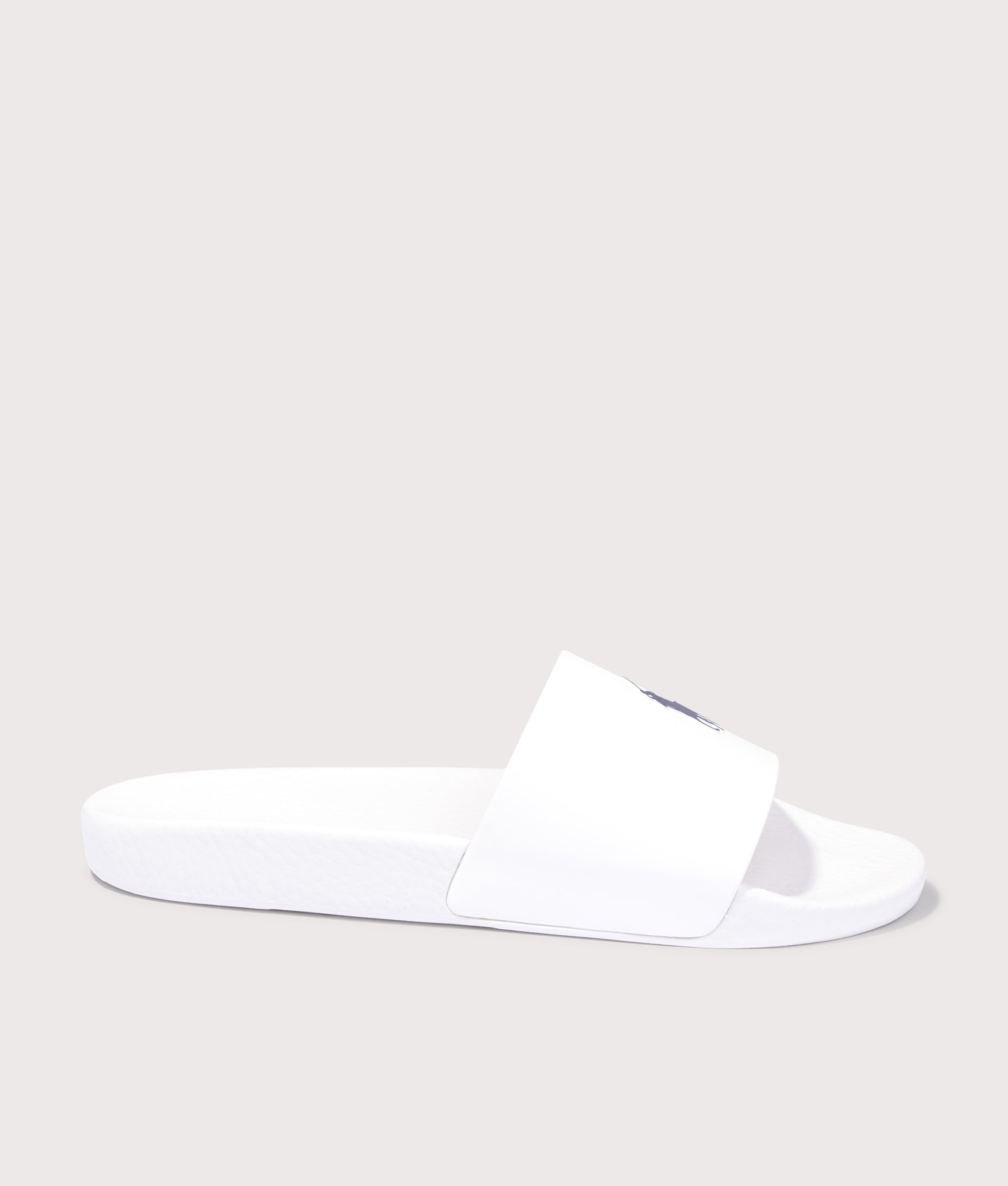 Polo Ralph Lauren Signature Pony Sliders in Ceramic White at EQVVS Menswear. Side shot.