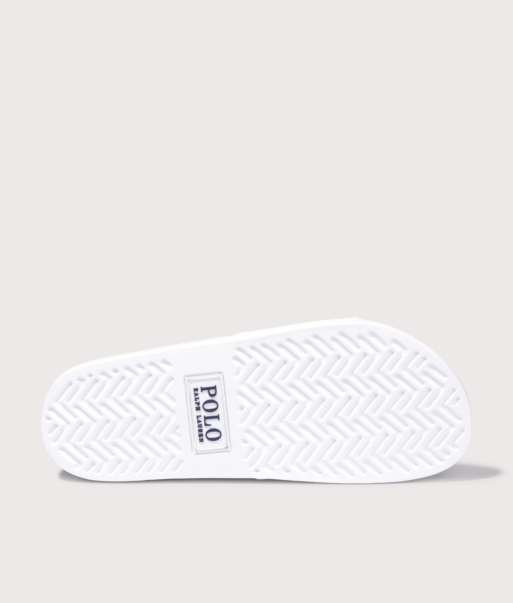 Polo Ralph Lauren Signature Pony Sliders in Ceramic White at EQVVS Menswear. Tread shot.