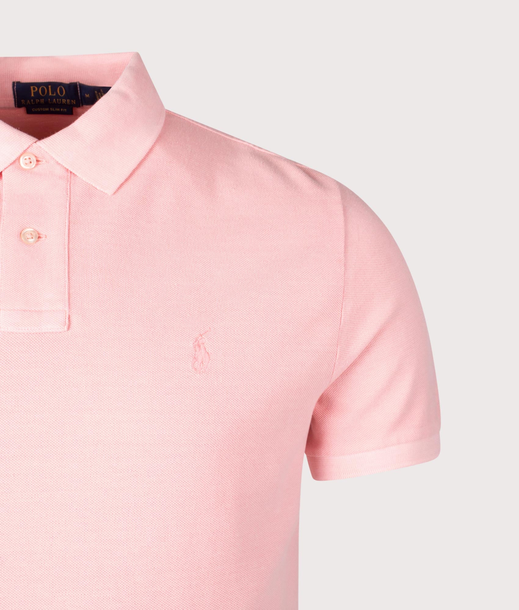 Polo Ralph Lauren Custom Slim Fit Mineral-Dyed Mesh Polo Shirt in Rose. Shot at EQVVS. Front detail shot 