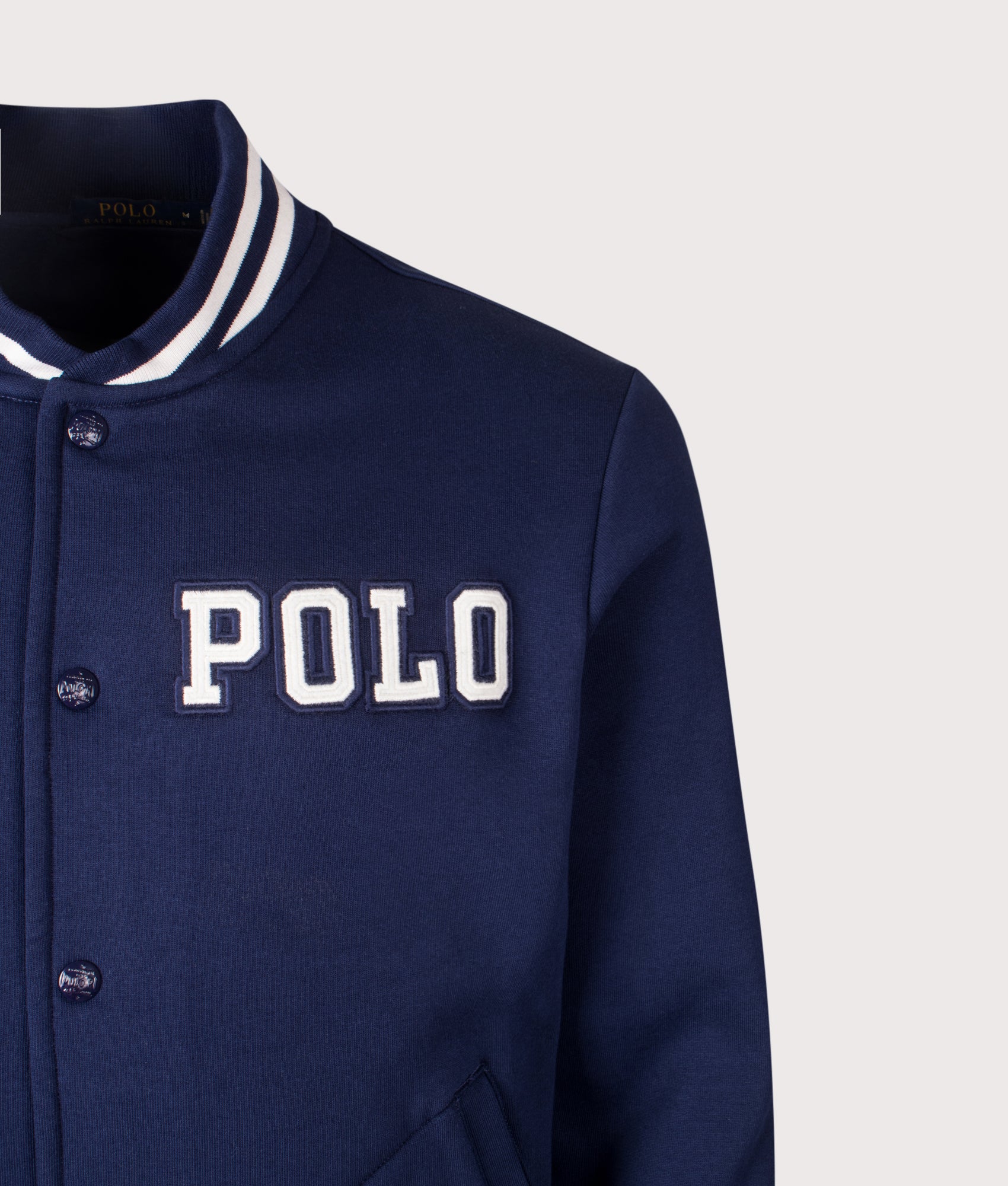 Logo Baseball Jacket by Polo Ralph Lauren in Newport Navy. Shot by EQVVS. Detail shot.