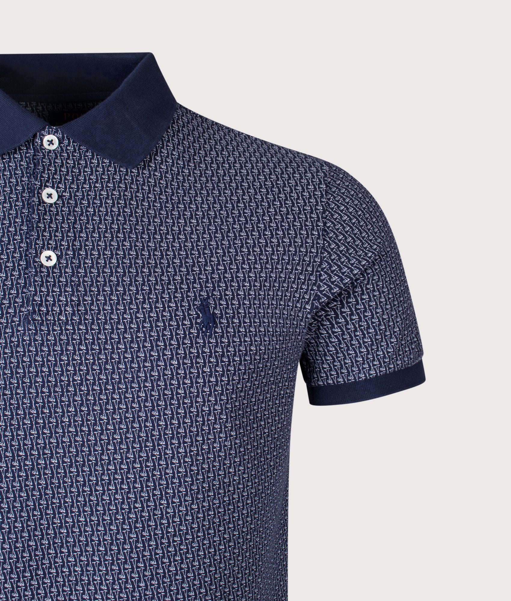 Custom Slim Fit Stretch Mesh Polo Shirt by Polo Ralph Lauren in Mini Mallets-Refined Navy. Shot by EQVVS. Detail shot.