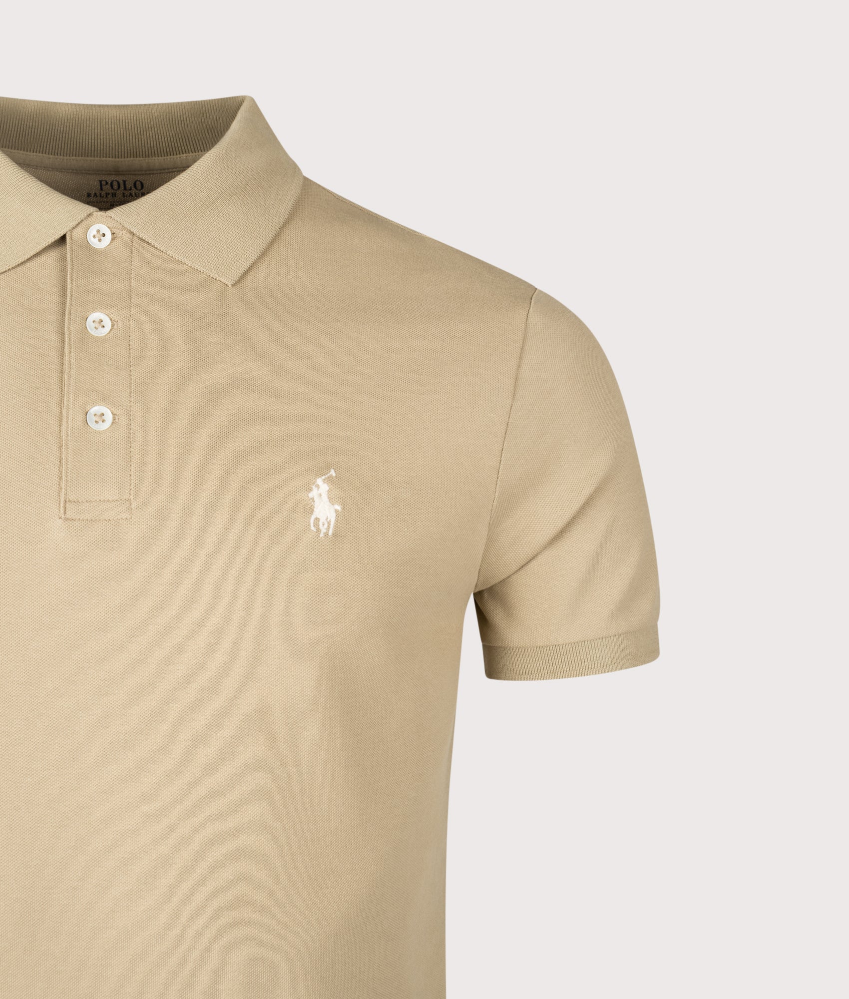 Custom Slim Fit Stretch Mesh Polo Shirt by Polo Ralph Lauren in Classic Khaki. Shot by EQVVS. Detail shot.