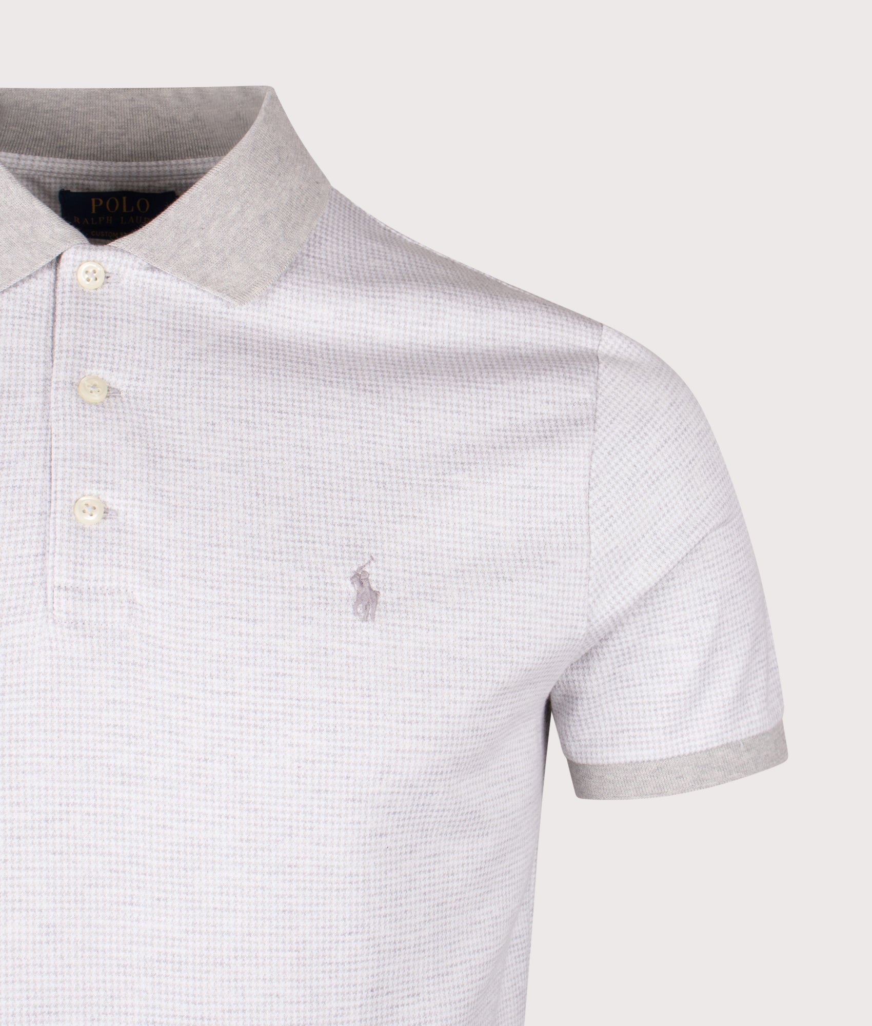 Custom Slim Fit Houndstooth Polo Shirt in Spring Heather/White. | 100% Cotton | Polo Ralph Lauren | Shot at EQVVS | Front detail shot 