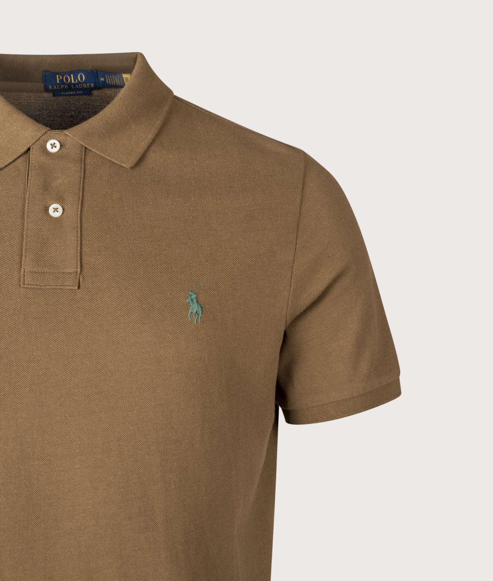 Classic Fit Iconic Mesh Polo Shirt by Polo Ralph Lauren in Nature Brown. Shoot by EQVVS. Detail shot.