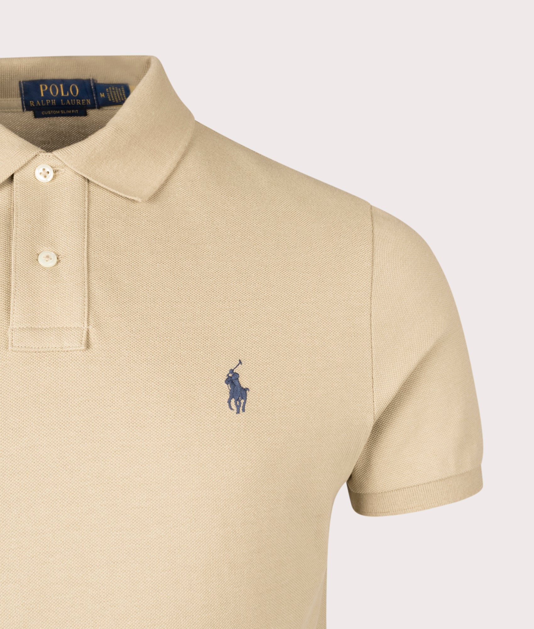 Custom Slim Fit Mesh Polo Shirt in Coastal Beige. 100% Cotton | Polo Ralph Lauren | Shot at EQVVS | Front detail shot