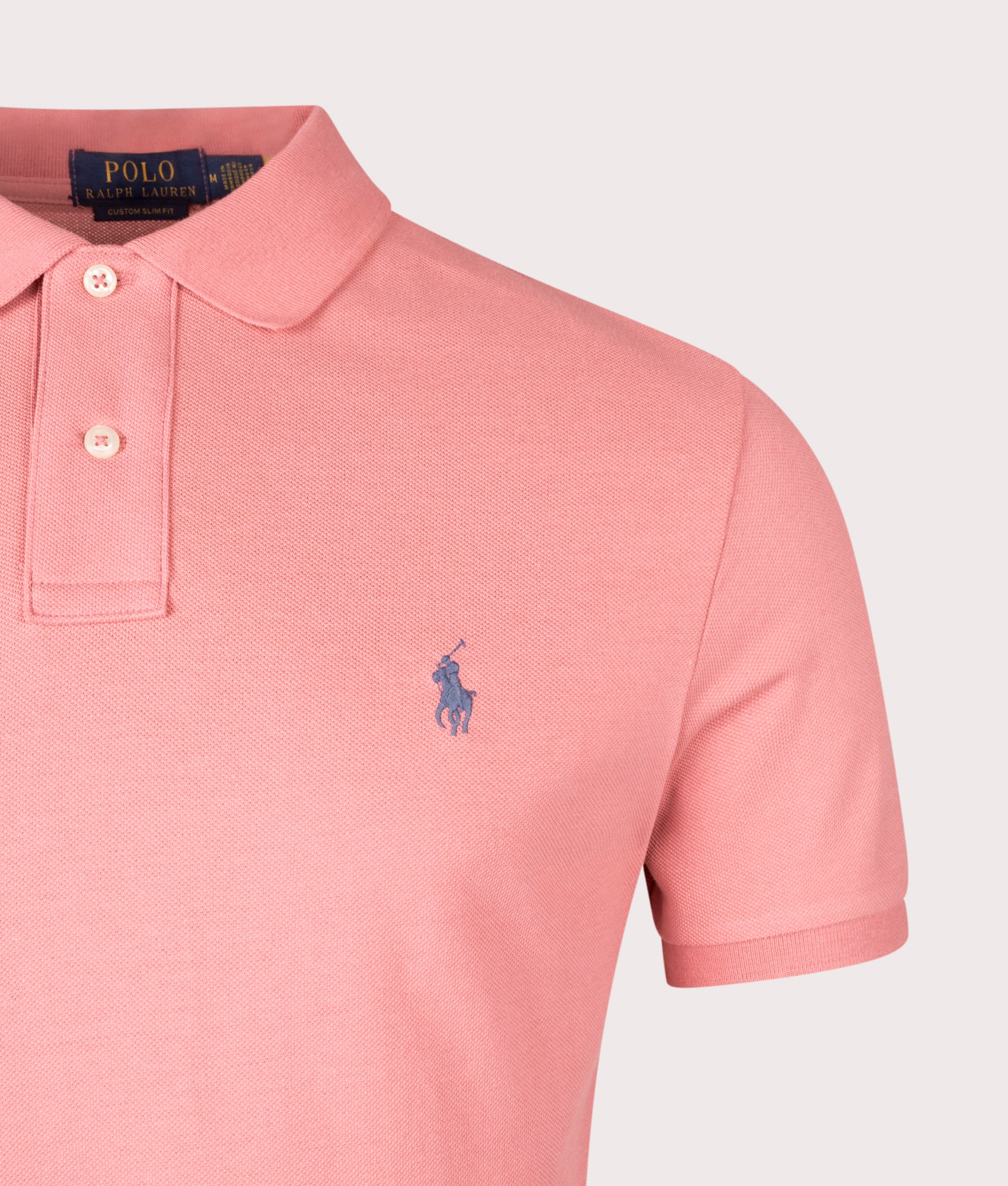 Custom Slim Fit Mesh Polo Shirt in Desert Rose. 100% Cotton | Polo Ralph Lauren | Shot at EQVVS | Front detail shot 