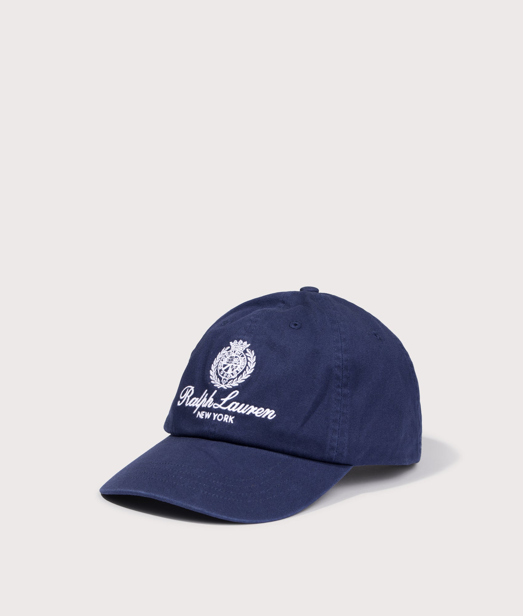Polo Ralph Lauren Crest Embroidered Baseball Cap in Newport Navy at EQVVS Menswear. Angled front shot.
