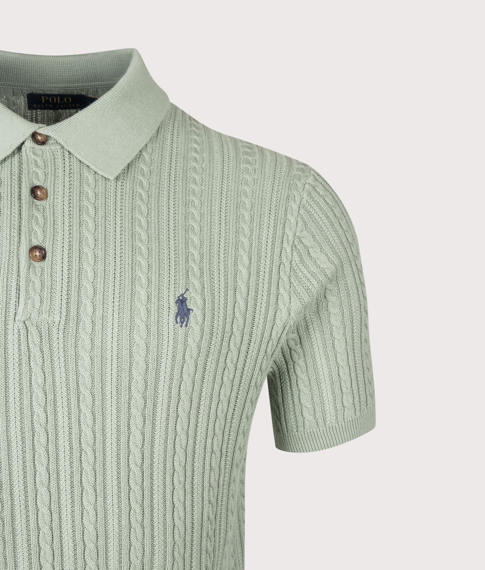 Polo Ralph Lauren Cable Knit Polo Shirt in Light Green at EQVVS Menswear. Detail shot.
