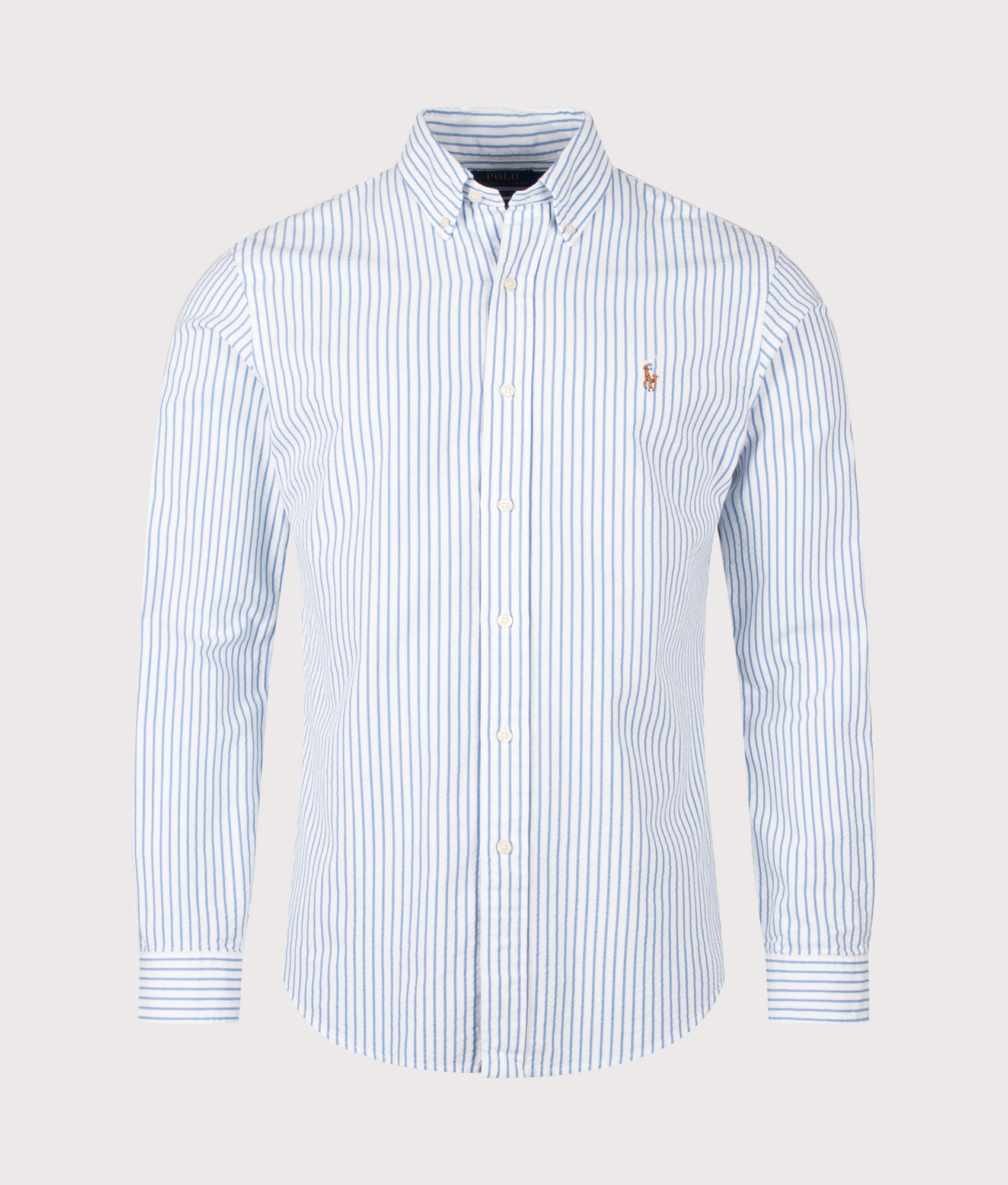 Polo Ralph Lauren Custom Fit Seersucker Oxford Shirt in White and BSR Blue stripe at EQVVS Menswear. Front shot.