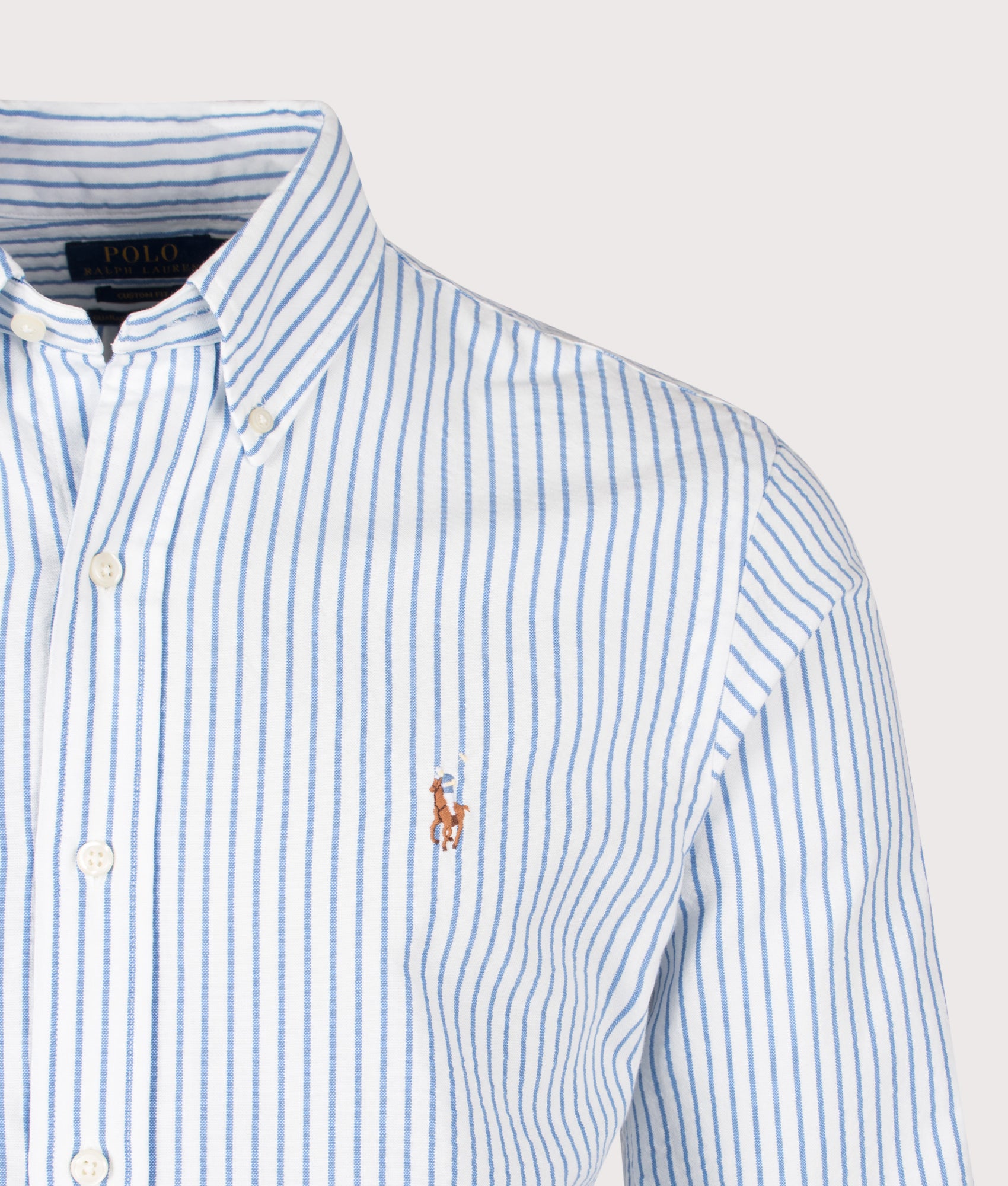 Polo Ralph Lauren Custom Fit Seersucker Oxford Shirt in White and BSR Blue stripe at EQVVS Menswear. Detail shot.