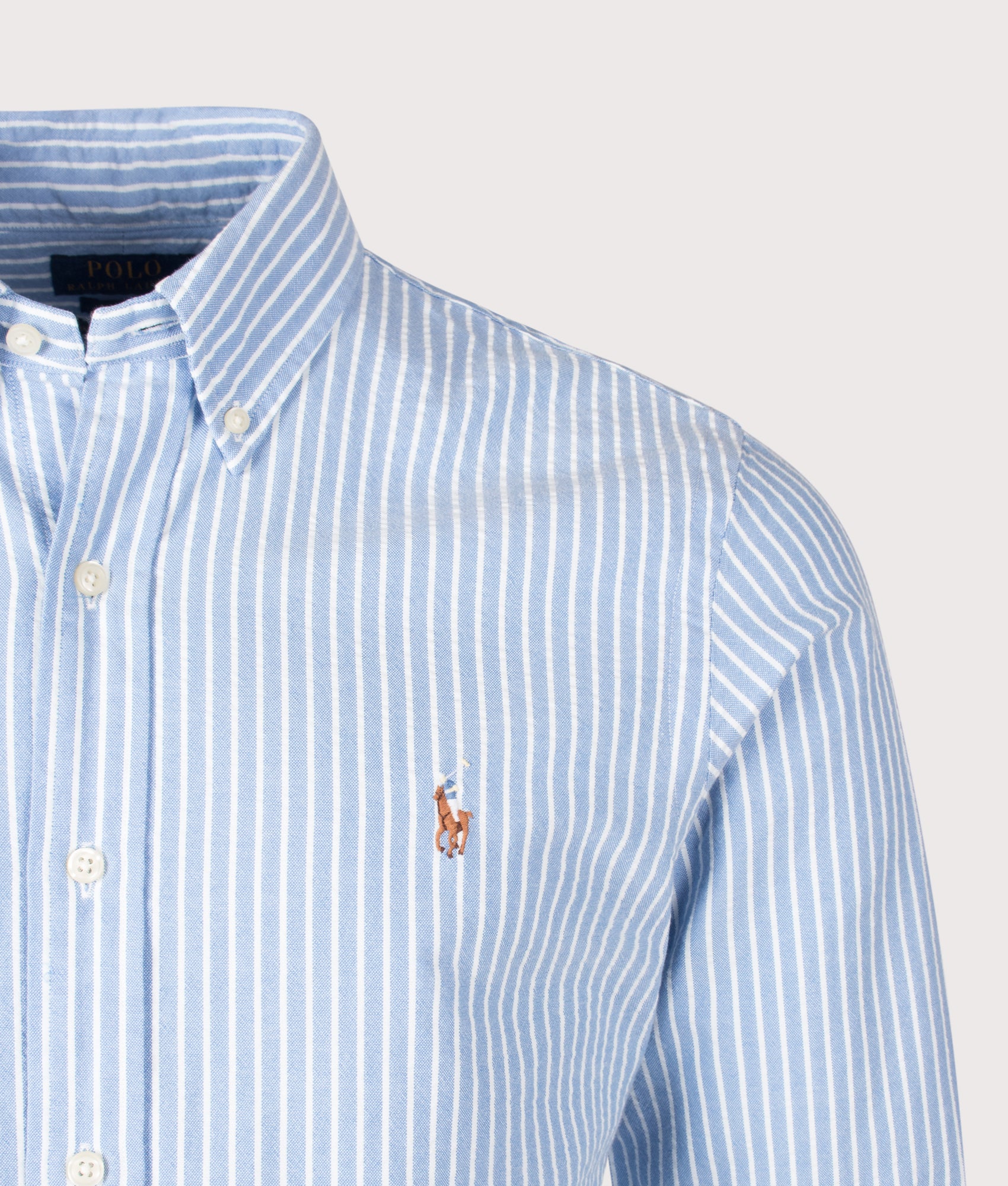 Polo Ralph Lauren Custom Fit Seersucker Oxford Shirt in BSR Blue and White stripe at EQVVS Menswear. Detail shot.