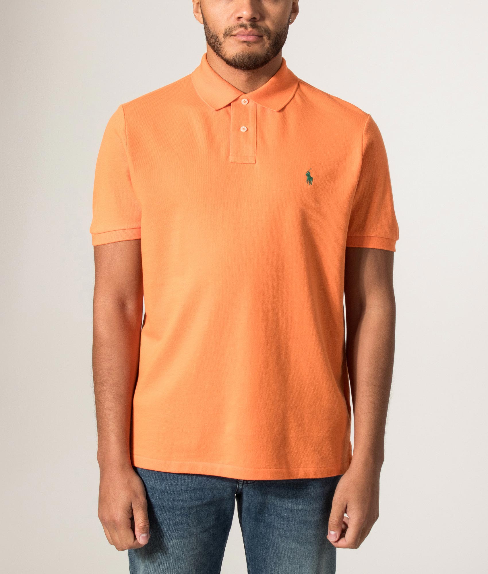 Custom Slim Fit Mesh Polo Shirt in Kona Orange by Polo Ralph Lauren. Shot by EQVVS. Model front shot.