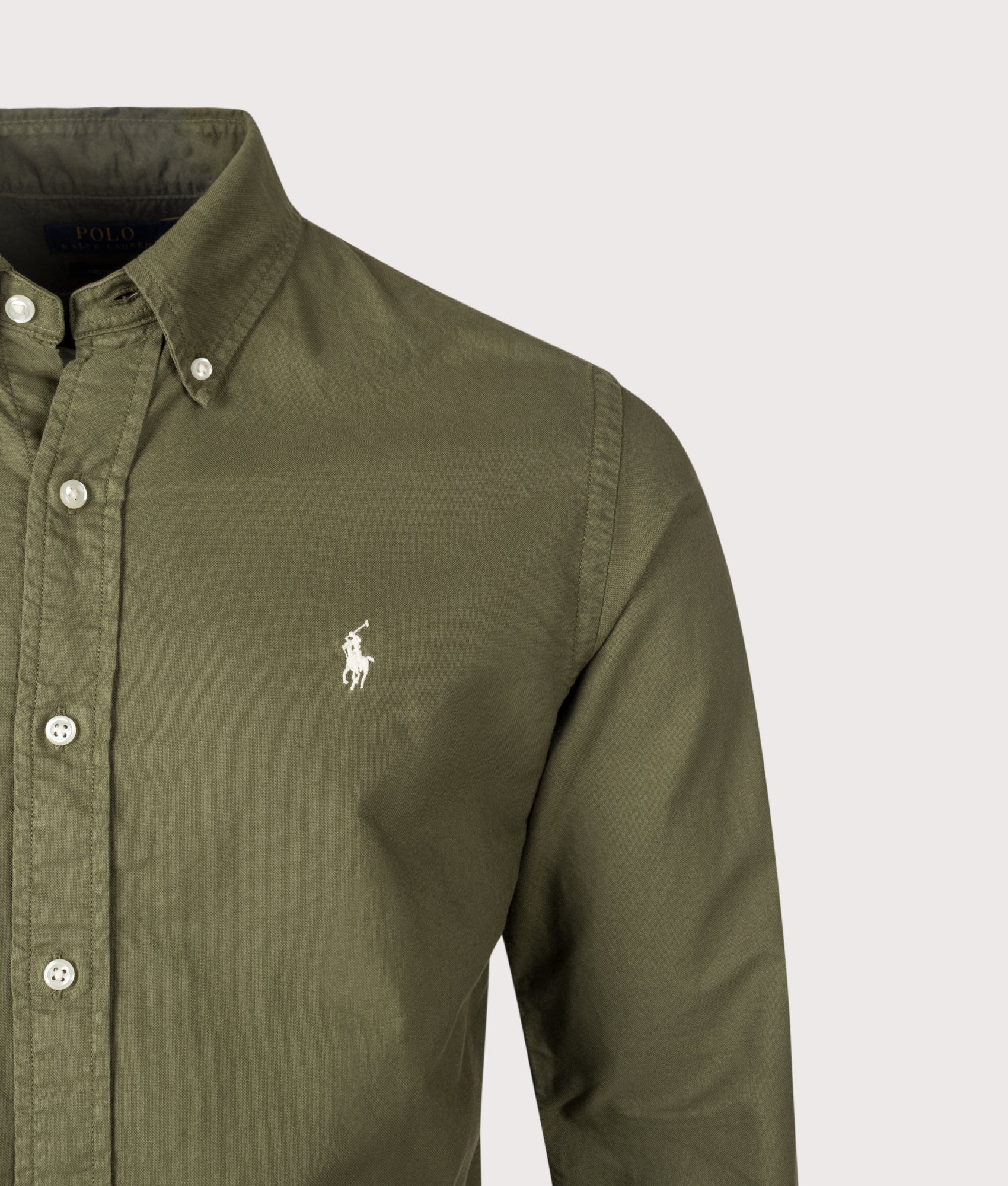 Polo Ralph Lauren Custom Fit Garment-Dyed Oxford Shirt in New Olive and Cream Polo Player at EQVVS Menswear.  Detail shot.