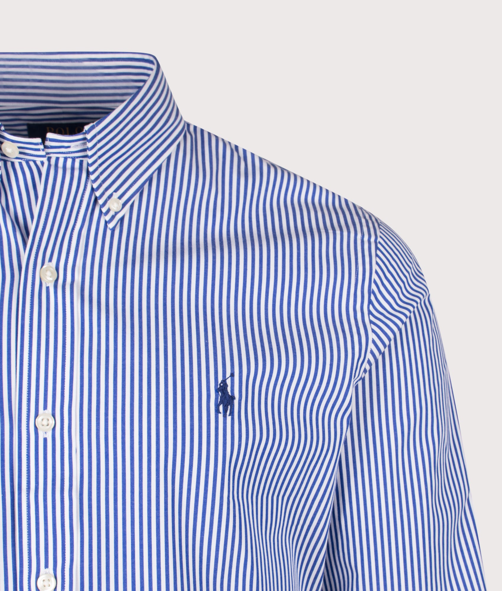 Polo Ralph Lauren Custom Fit Striped Stretch Poplin Shirt in Blue/White Bengal Stripe at EQVVS Menswear. Detail shot.