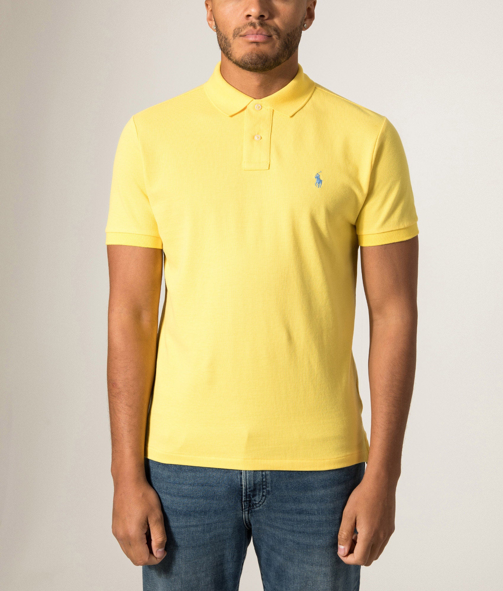 Polo Ralph Lauren Custom Slim Fit Mesh Polo Shirt in Sunfish Yellow at EQVVS Menswear. Model front shot.