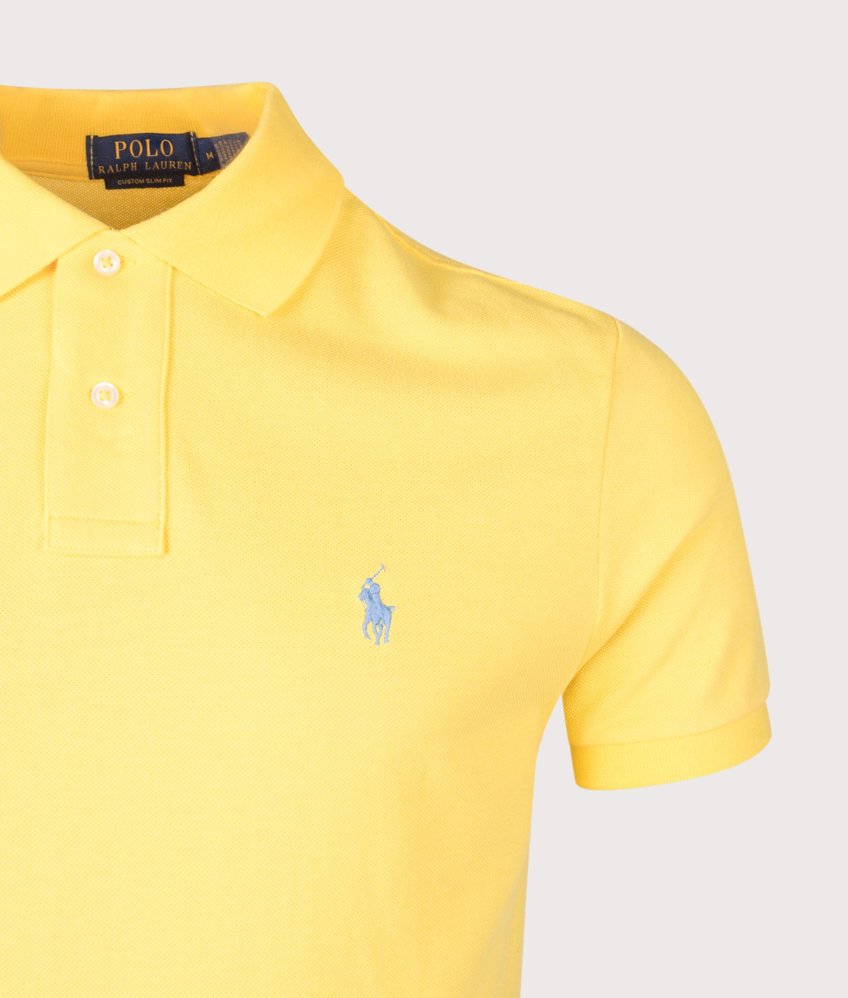 Polo Ralph Lauren Custom Slim Fit Mesh Polo Shirt in Sunfish Yellow at EQVVS Menswear. Detail shot.