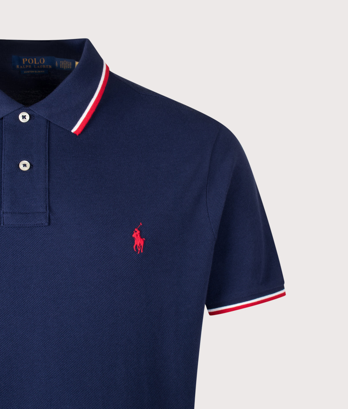 Polo Ralph Lauren Custom Slim Fit Mesh Polo Shirt in Newport Navy and Red at EQVVS Menswear. Detail shot.