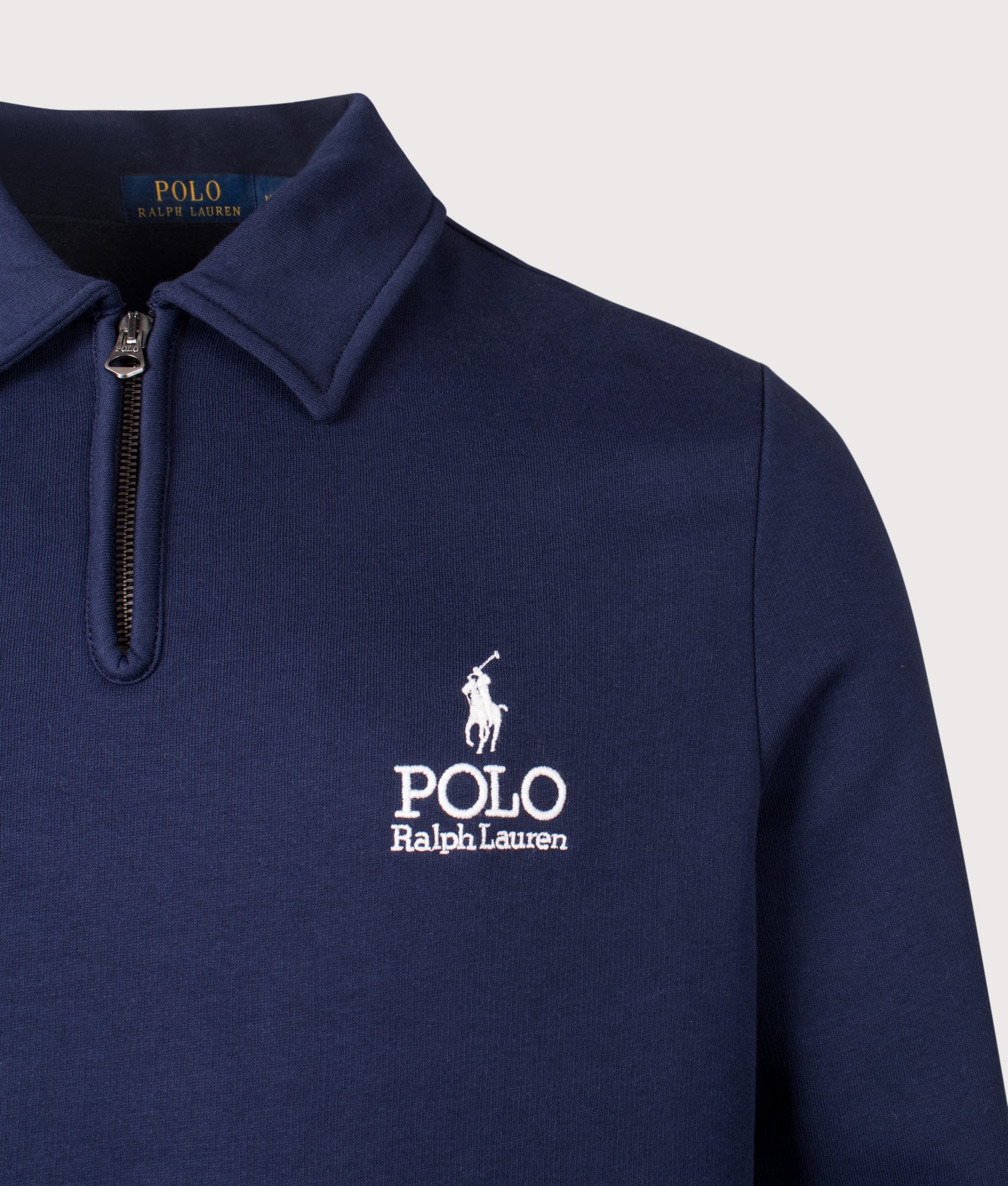 Polo Ralph Lauren Collared Quarter Zip Logo Sweatshirt in Cruise Navy at EQVVS Menswear. Detail shot.