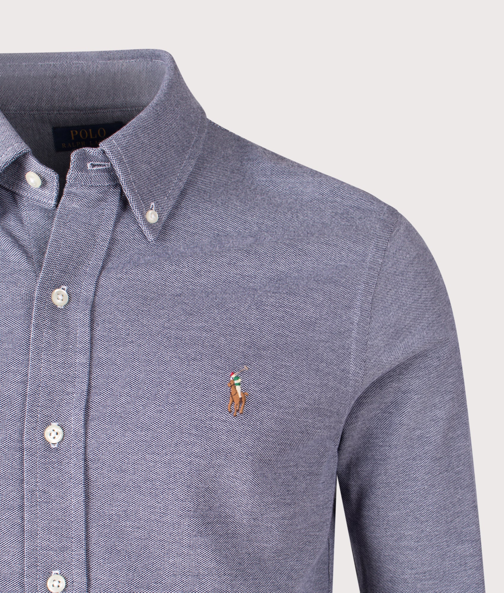 Polo Ralph Lauren Mesh Knit Oxford Shirt in Newport Navy and Multi Polo Pony at EQVVS Menswear. Detail shot.