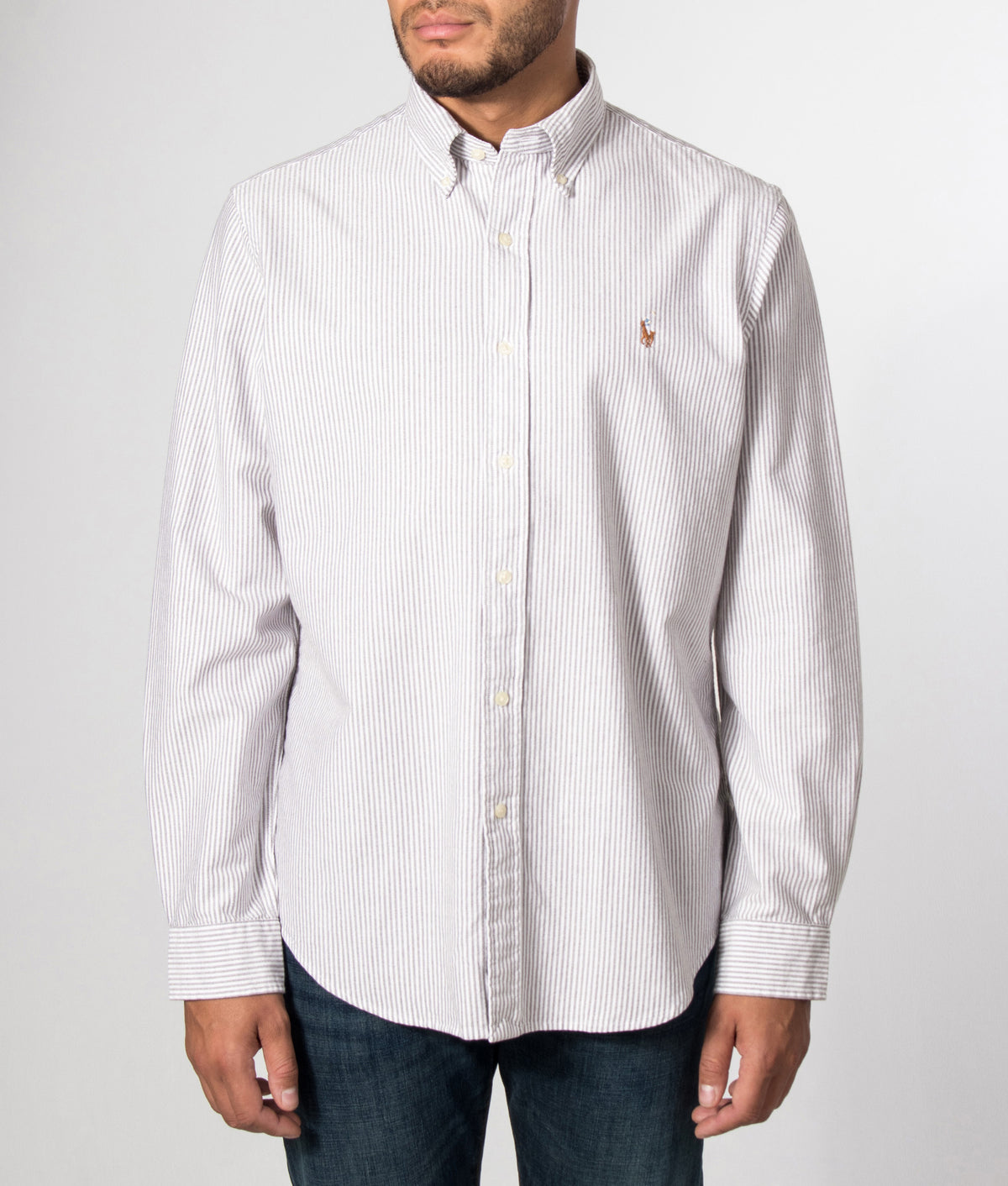 Polo Ralph Lauren Custom Fit Striped Oxford Shirt in Nutmeg Brown and White stripe at EQVVS Menswear. Model front shot.