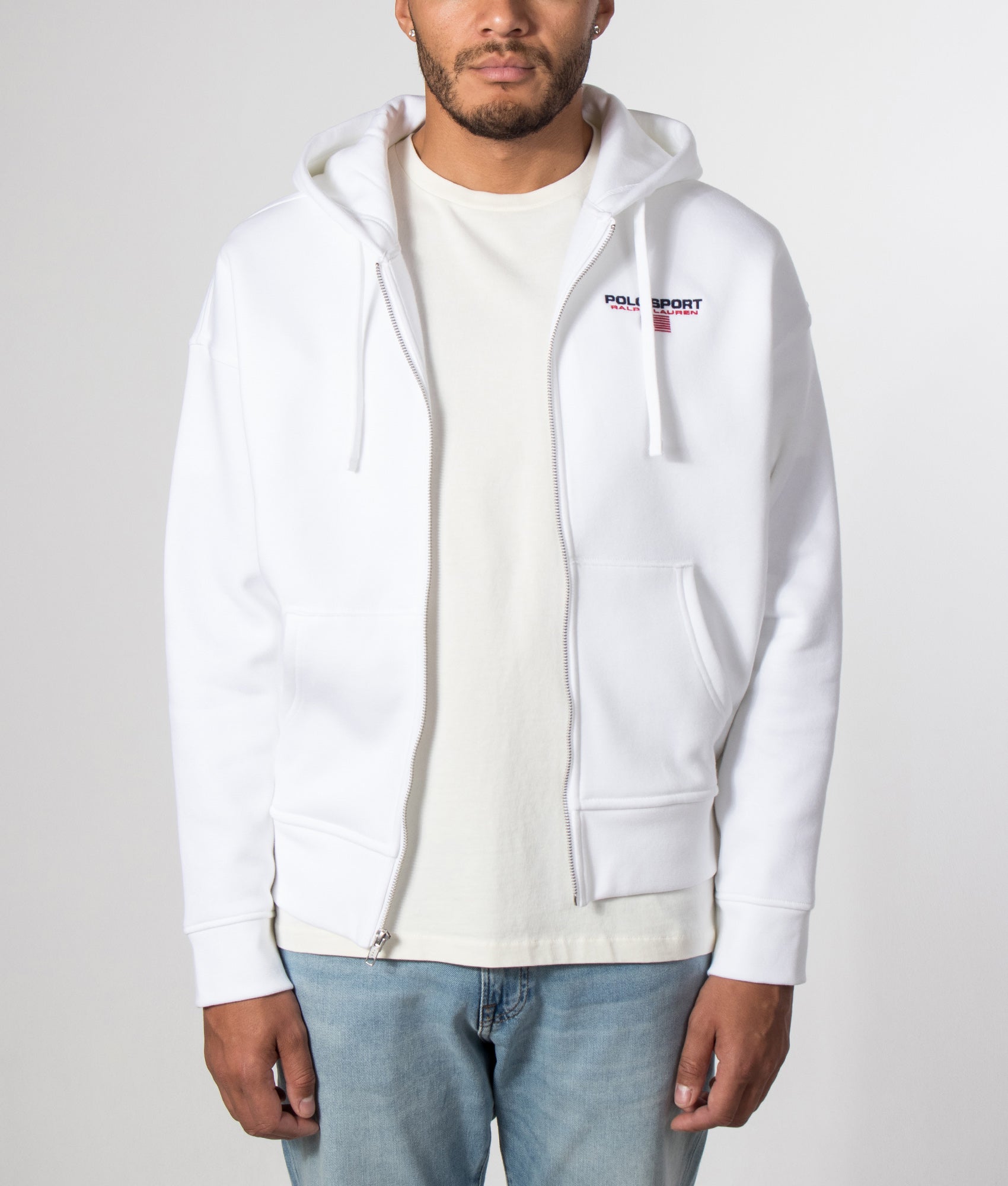 Polo Ralph Lauren Relaxed Fit Polo Sport Flag Logo Hoodie in White and Cruise Navy at EQVVS Menswear. Model open hoodie shot.