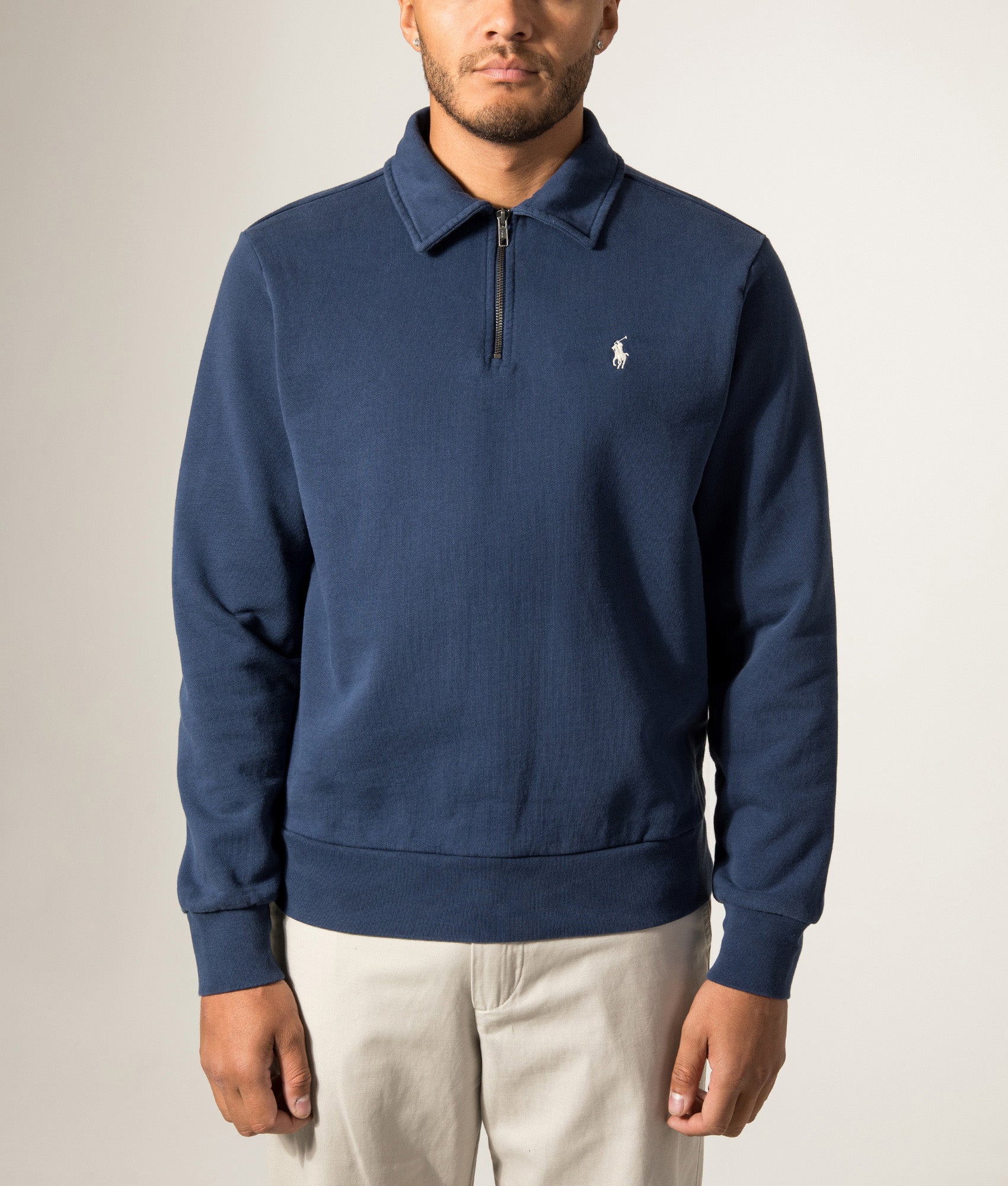 Polo Ralph Lauren Loopback Quarter Zip Sweatshirt in Cruise Navy at EQVVS Menswear. Model front shot.