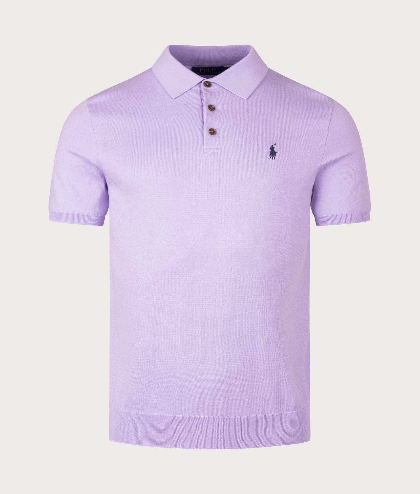 Knitted Cotton Polo Shirt in Powder Purple by Polo Ralph Lauren. Shot by EQVVS. Front shot.