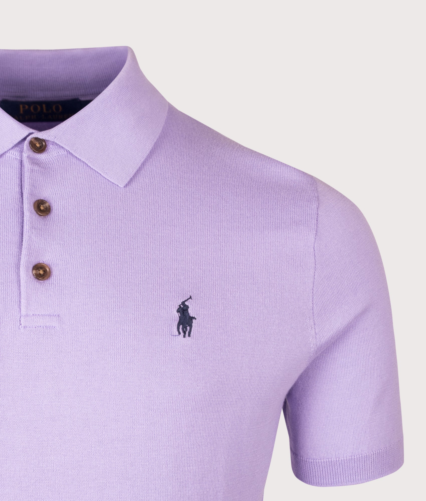 Knitted Cotton Polo Shirt in Powder Purple by Polo Ralph Lauren. Shot by EQVVS. Detail shot.