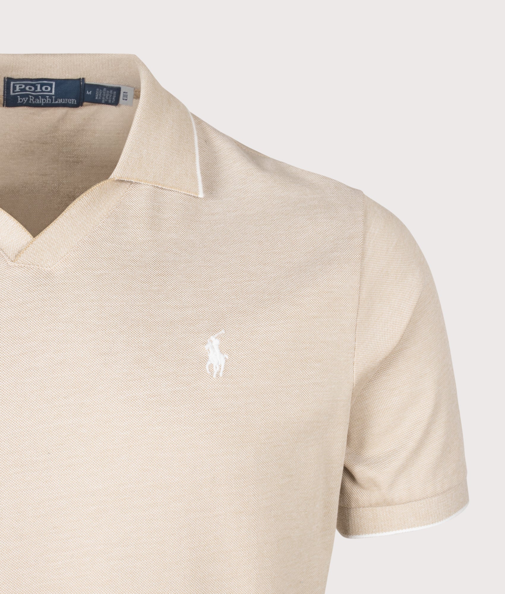 Jacquard Mesh Polo Shirt in Coastal by Beige Polo Ralph Lauren. Shot by EQVVS. Detail shot.