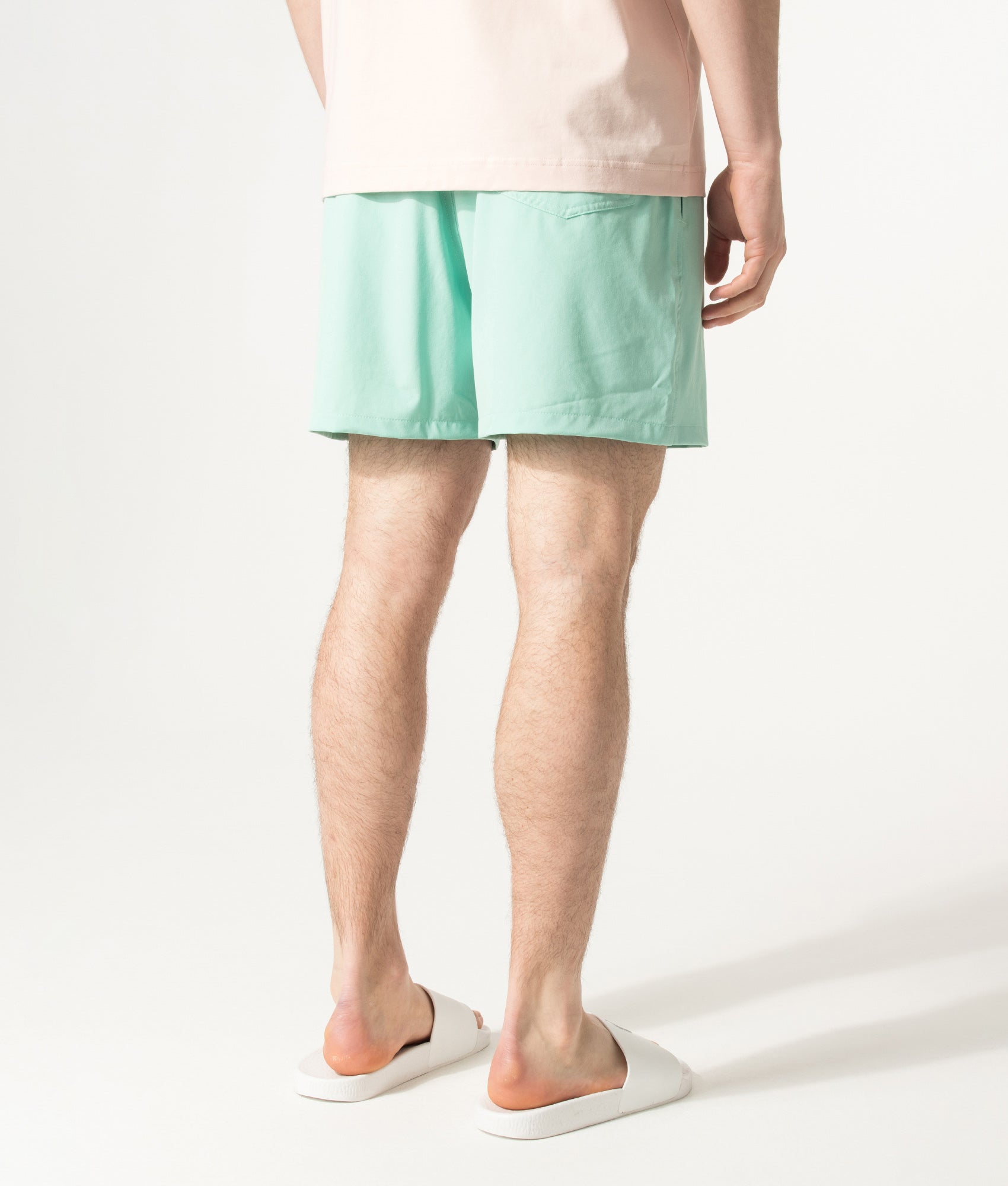 Polo Ralph Lauren Regular Fit Classic Swim Trunks in Celadon at EQVVS Menswear. Angled model back shot.